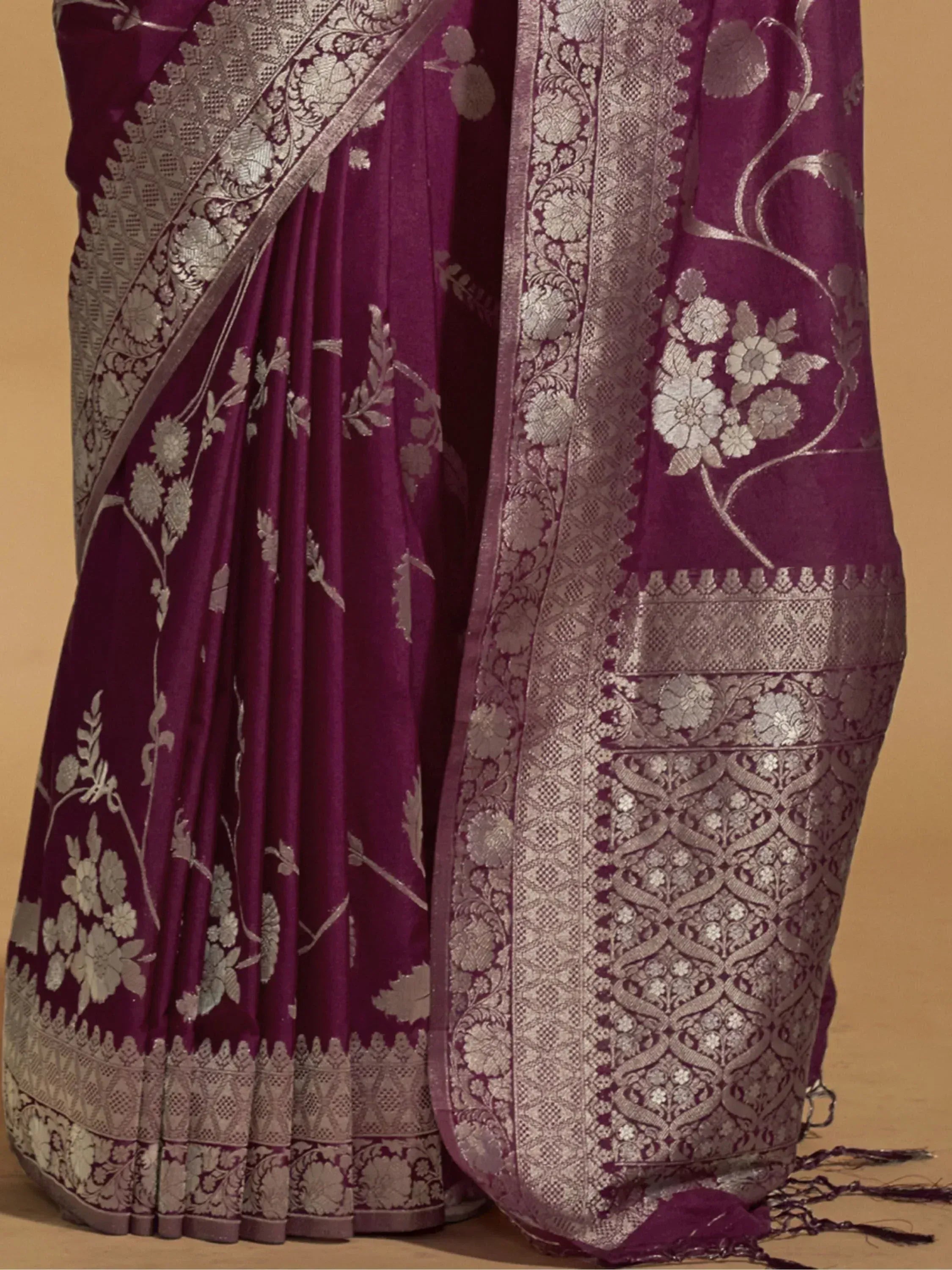 Purple designer saree with silver floral zari work and intricate border, ideal for Indian ethnic occasions