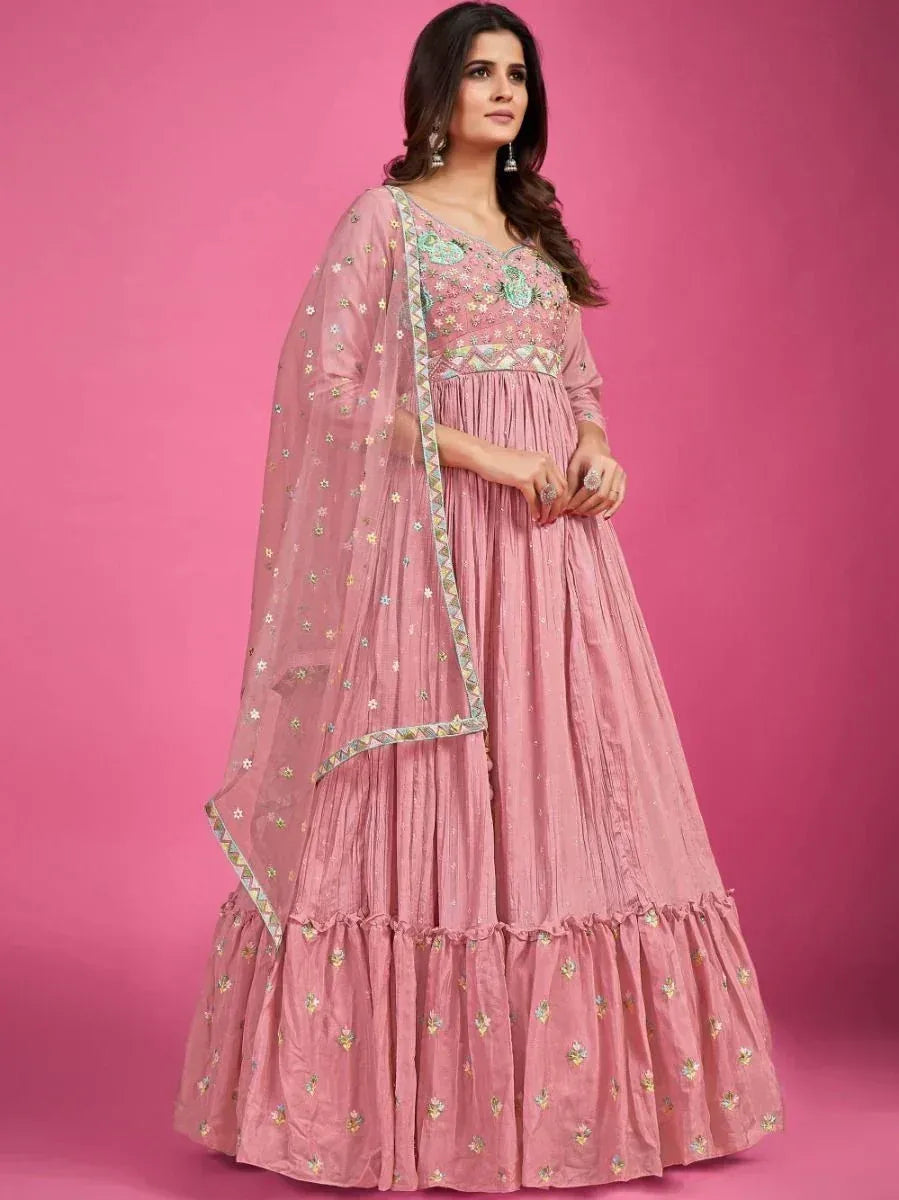 Pink embroidered lehenga choli with floral motifs and sheer dupatta, ideal for Indian ethnic occasions