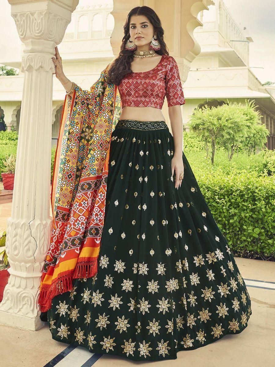 Elegant green lehenga choli with gold embroidery, paired with colorful dupatta, perfect for Indian ethnic wear occasions.