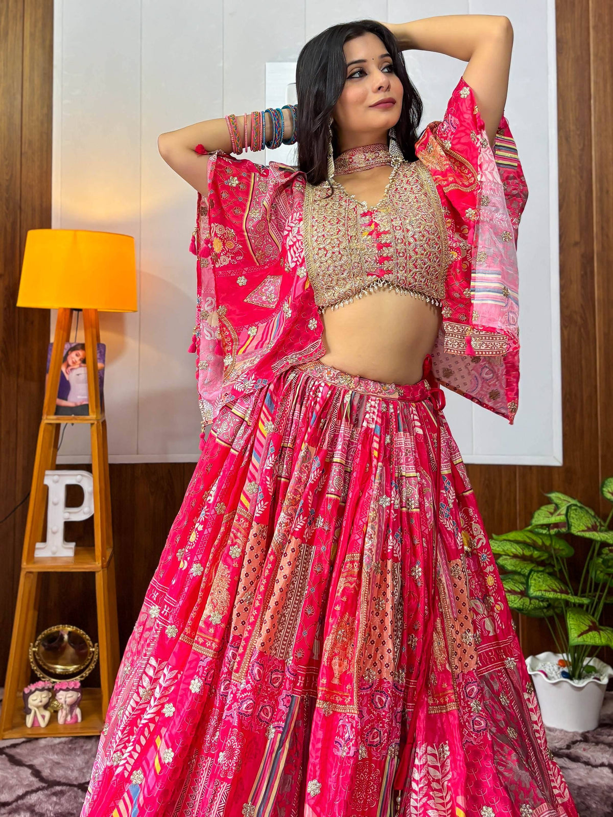 Pink printed lehenga choli with gold embroidery, perfect for Indian ethnic wear and festive occasions.