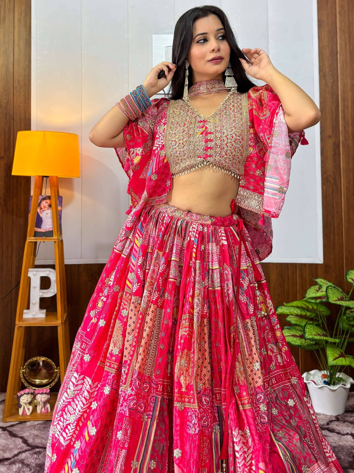 Pink printed lehenga choli with gold embroidery, perfect for Indian ethnic wear and festive occasions.