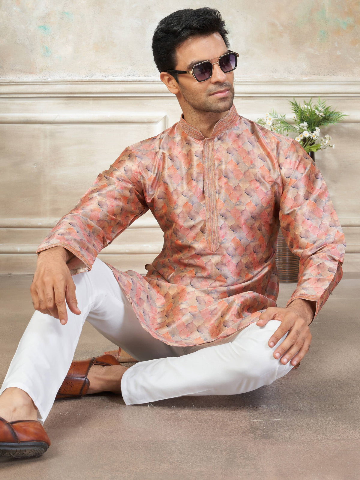 Man in stylish printed kurta with white pants, perfect for ethnic occasions