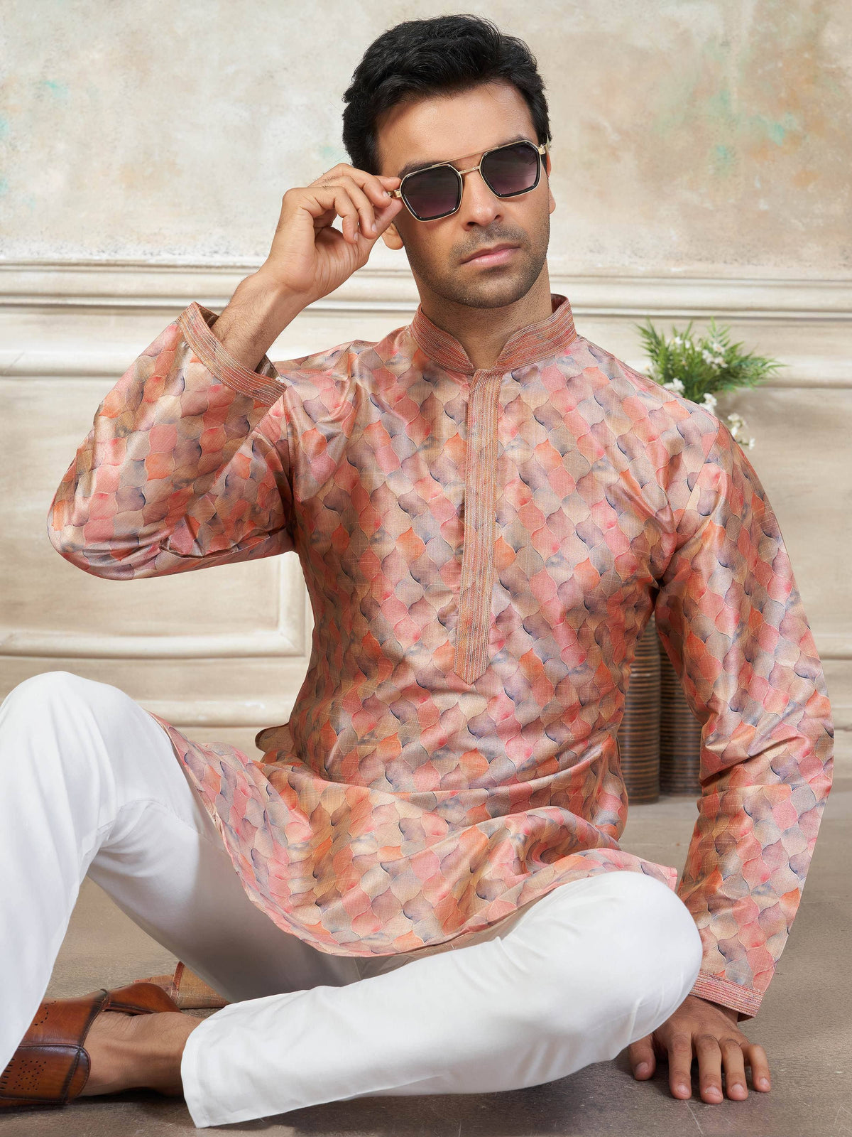 Man in stylish printed kurta with white pants, perfect for ethnic occasions