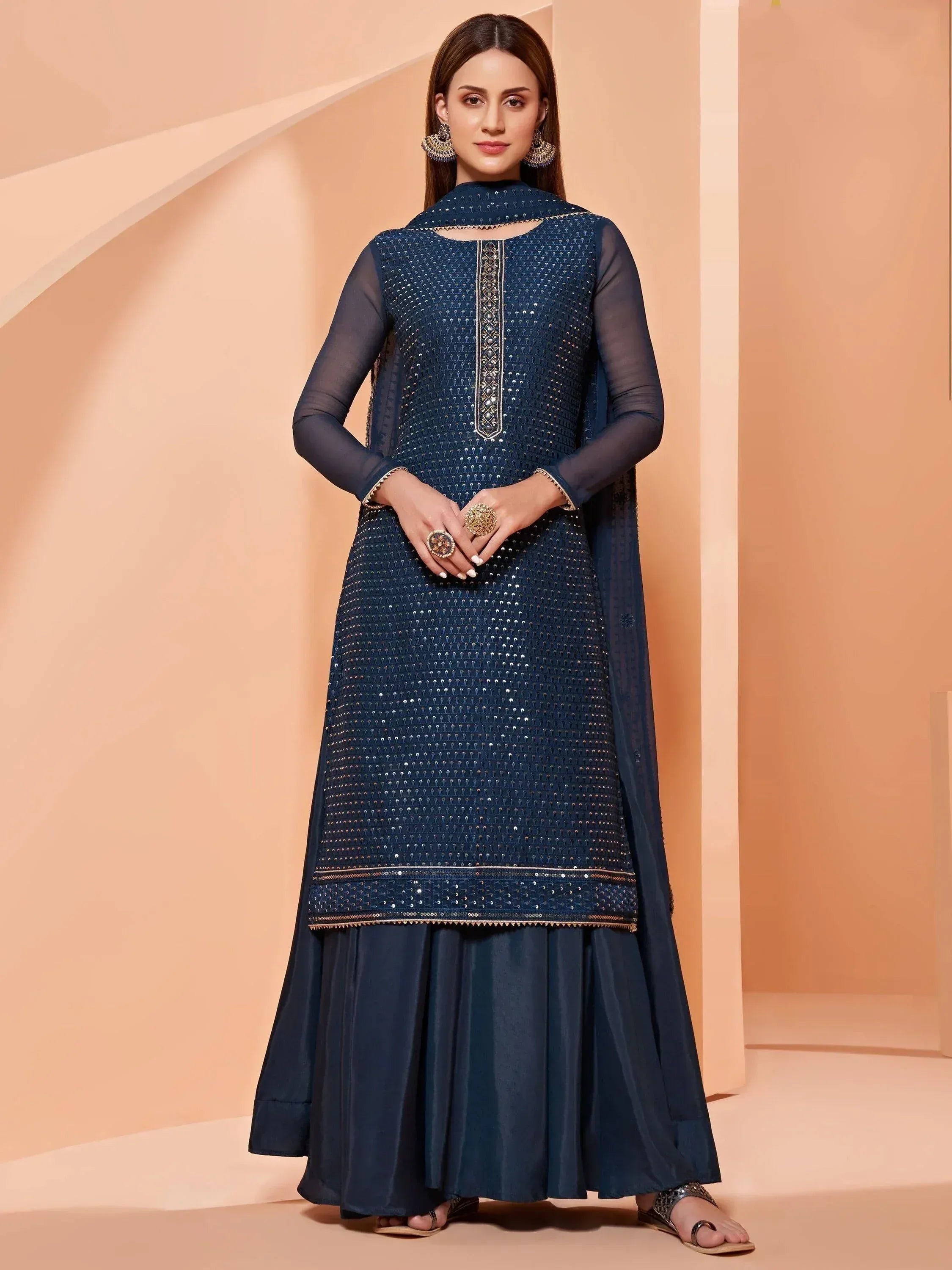 Elegant navy blue designer salwar kameez with sequin detailing and sheer sleeves for ethnic wear.