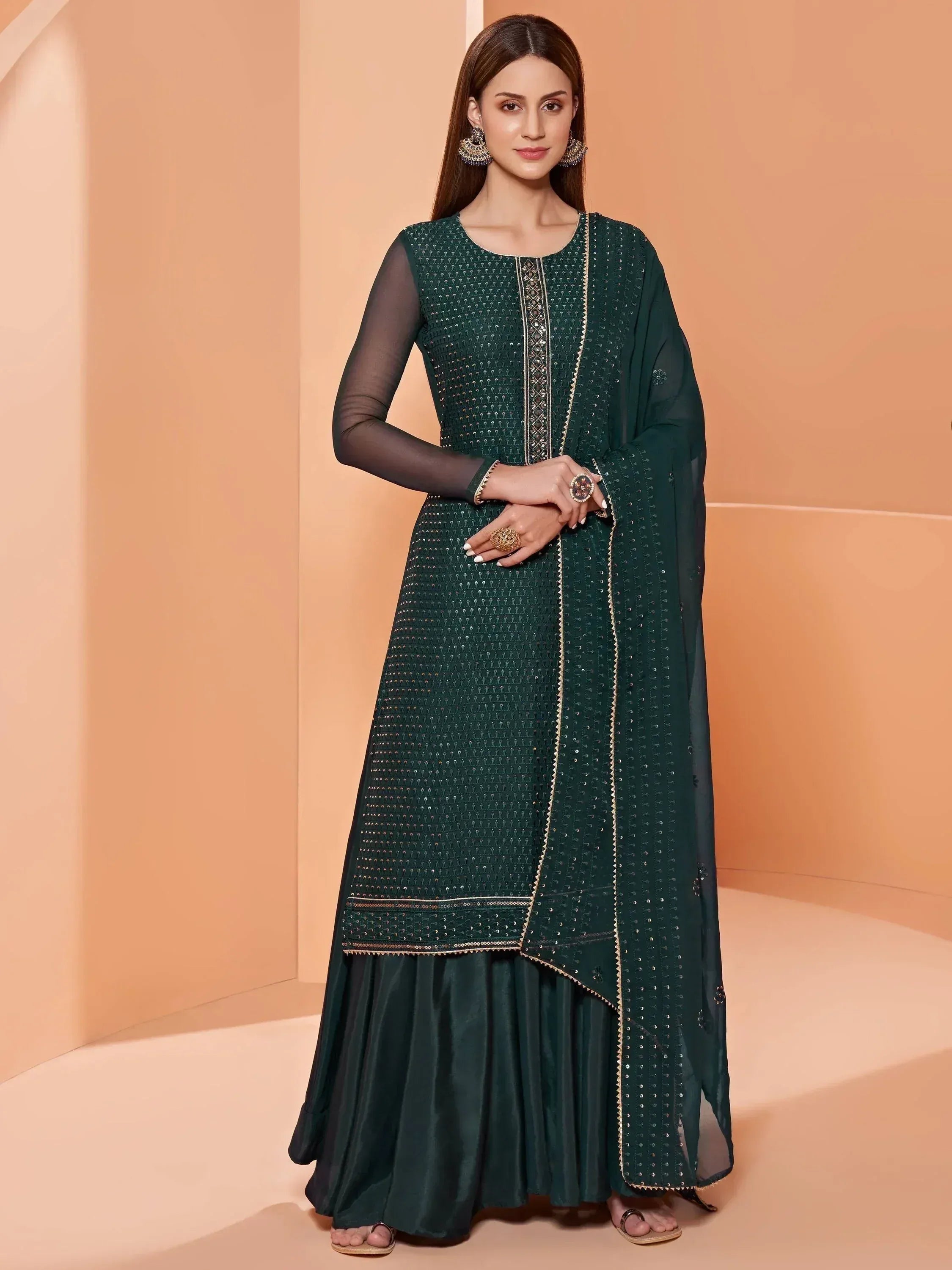 Emerald green embroidered anarkali suit with sheer sleeves and dupatta, perfect for Indian ethnic wear occasions.