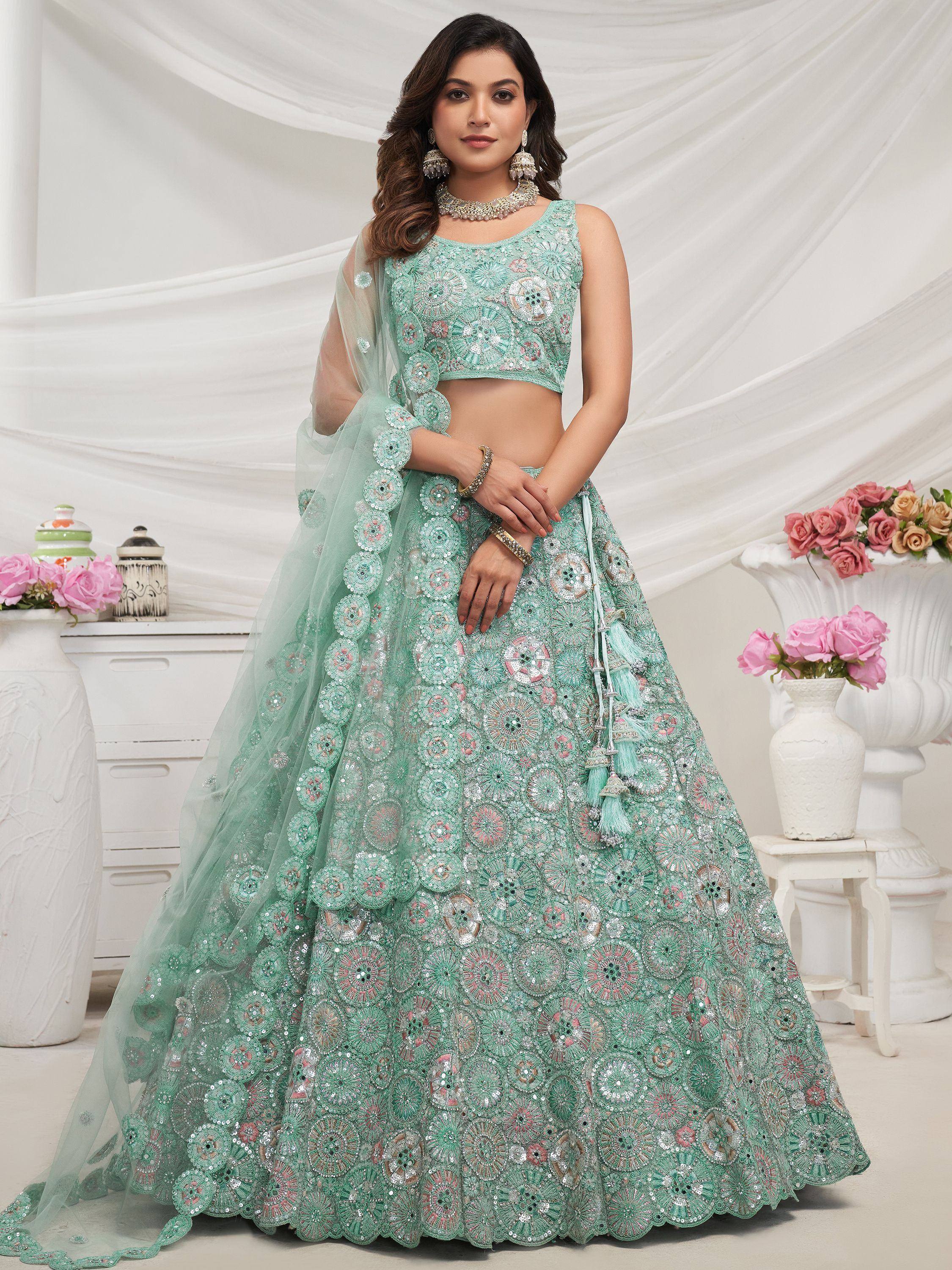 Mint green designer lehenga choli with heavy floral embroidery and sequins, perfect for weddings and parties