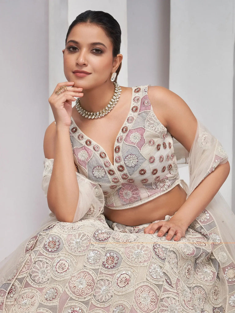 Impressive Ivory Embroidered Net Designer Lehenga Choli With Dupatta