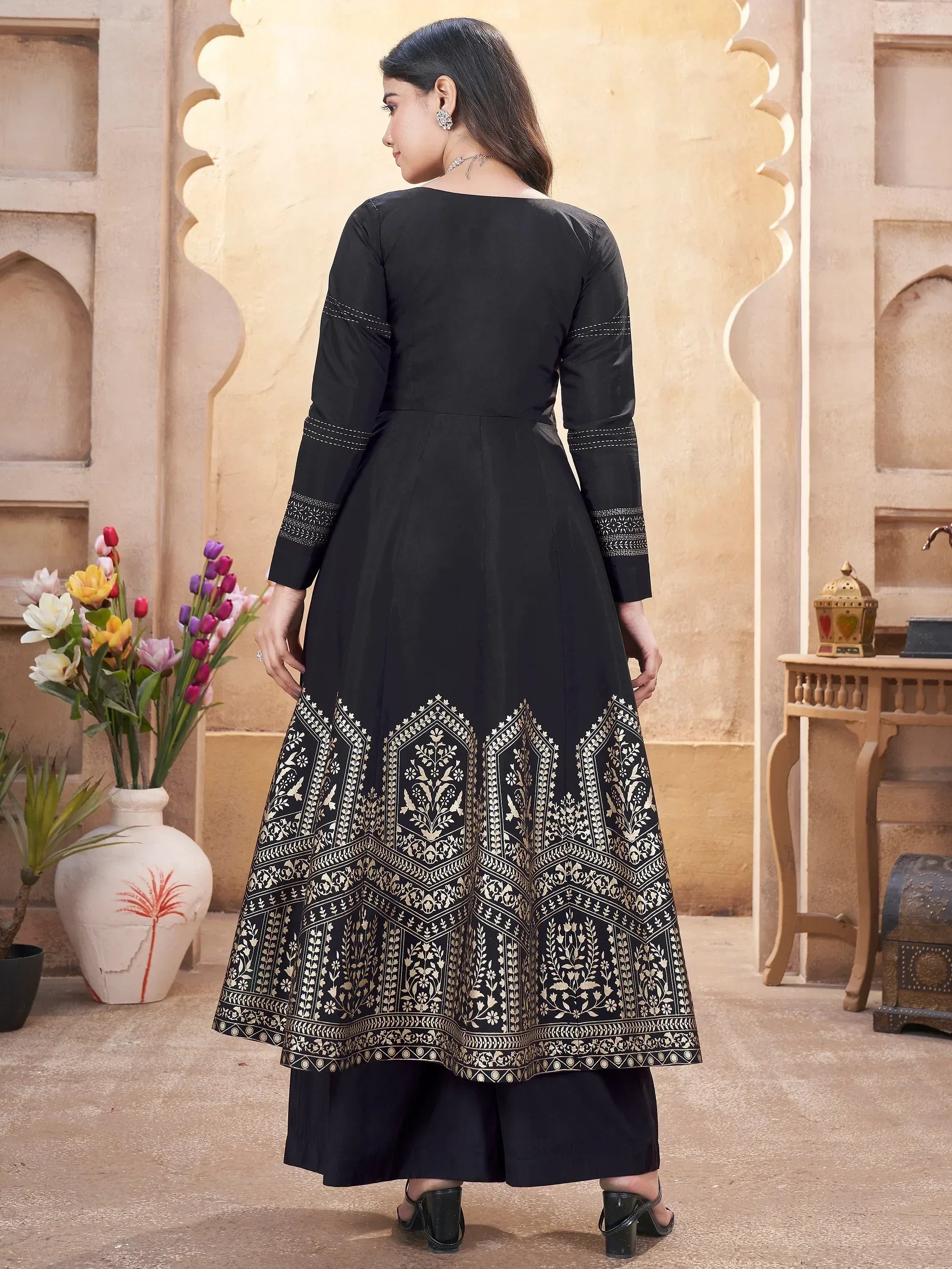 Black ethnic anarkali with gold floral embroidery, perfect for Indian occasions and festive wear.