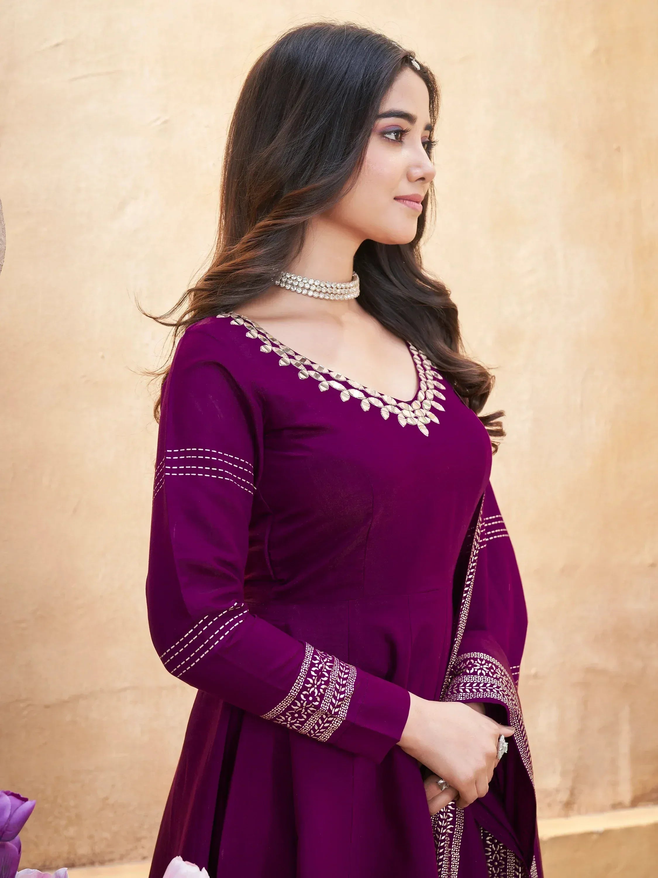 Purple ethnic gown with mirror work and embroidery, perfect for Indian occasions