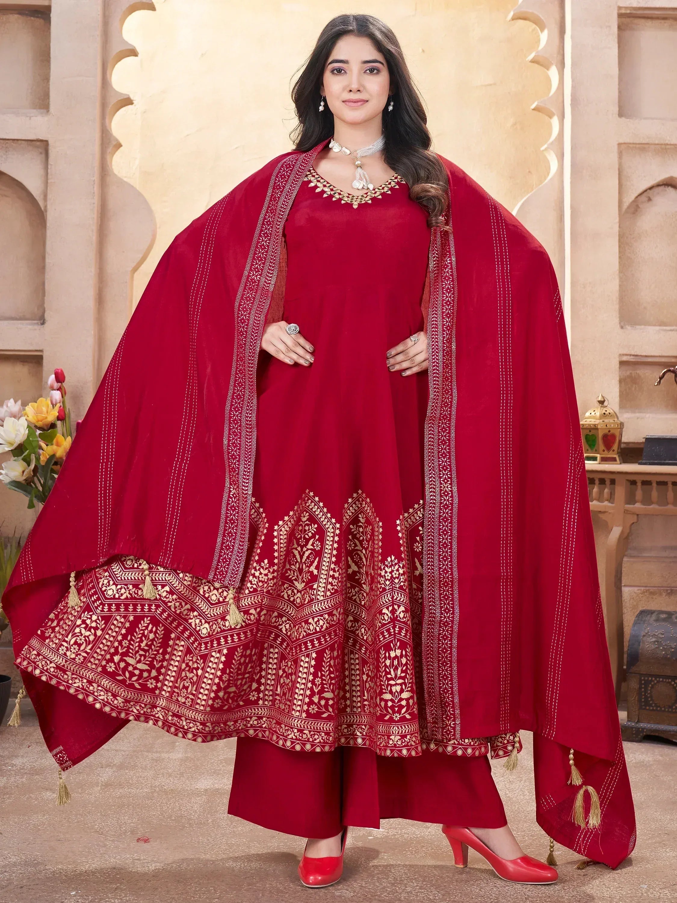 Red ethnic anarkali suit with gold embroidery and dupatta, perfect for Indian festive occasions