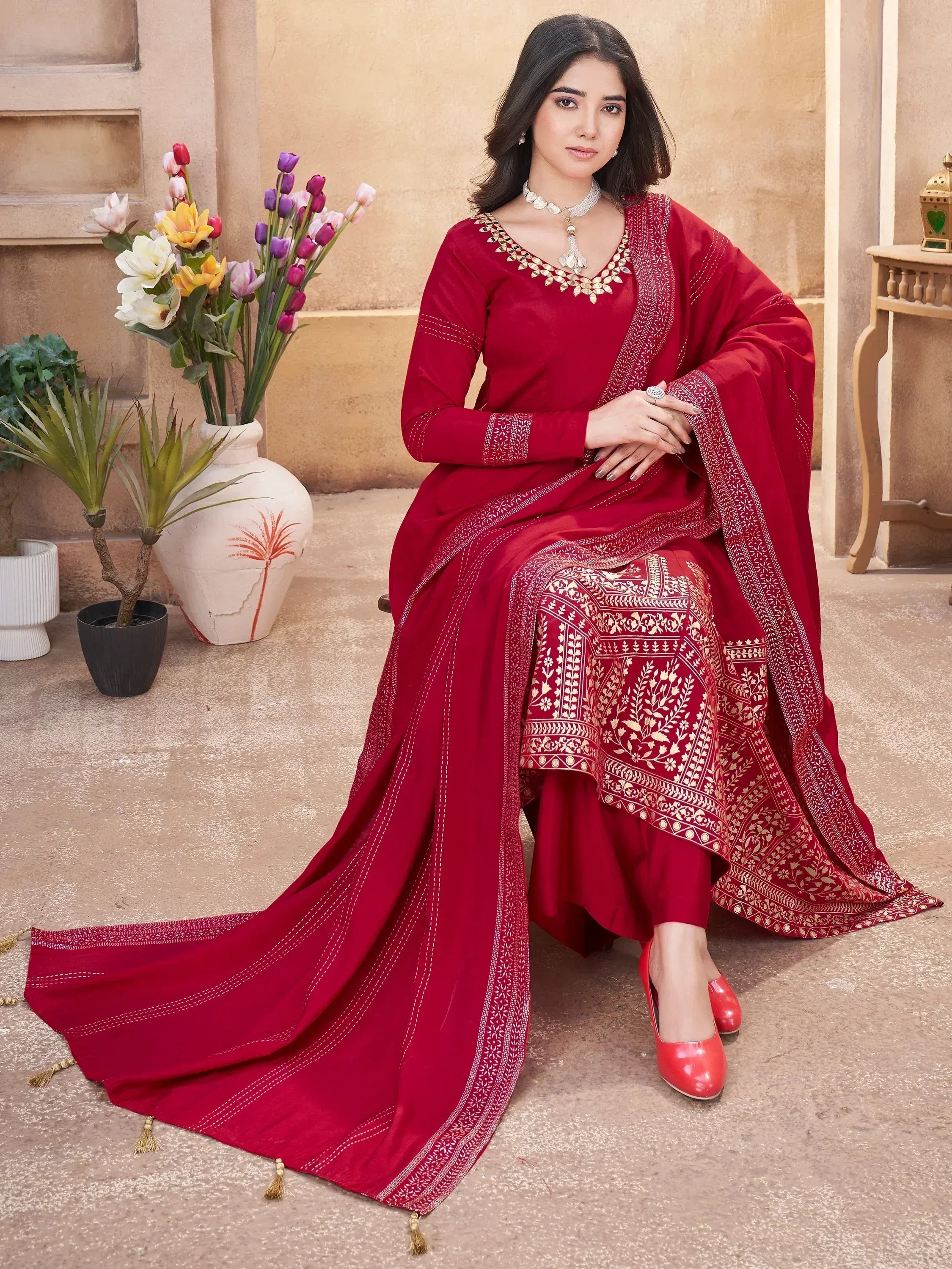 Red embroidered salwar kameez with gold detailing, perfect for Indian ethnic wear occasions