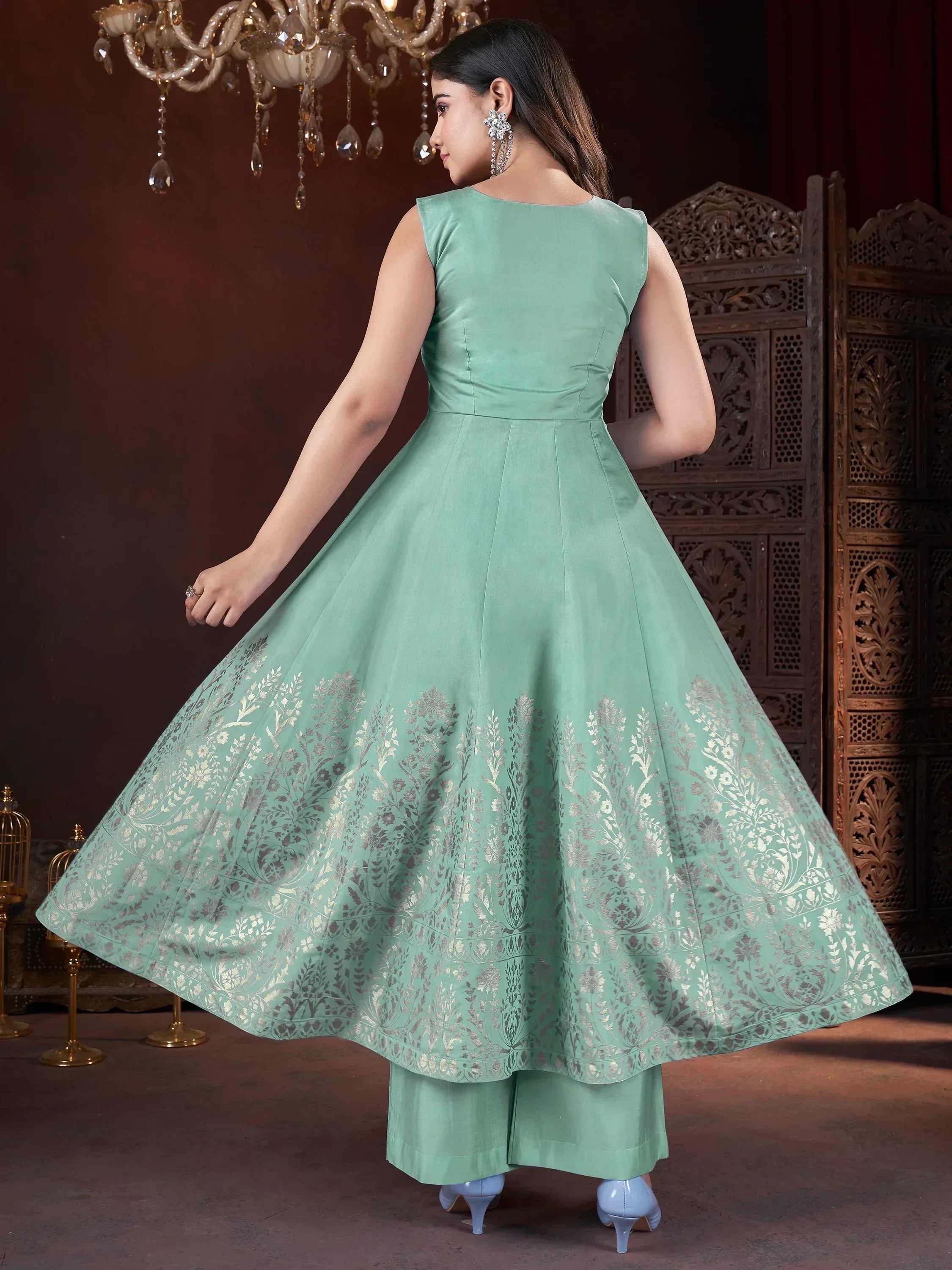 Mint green ethnic gown with silver floral embroidery, paired with palazzo pants, perfect for Indian occasions.