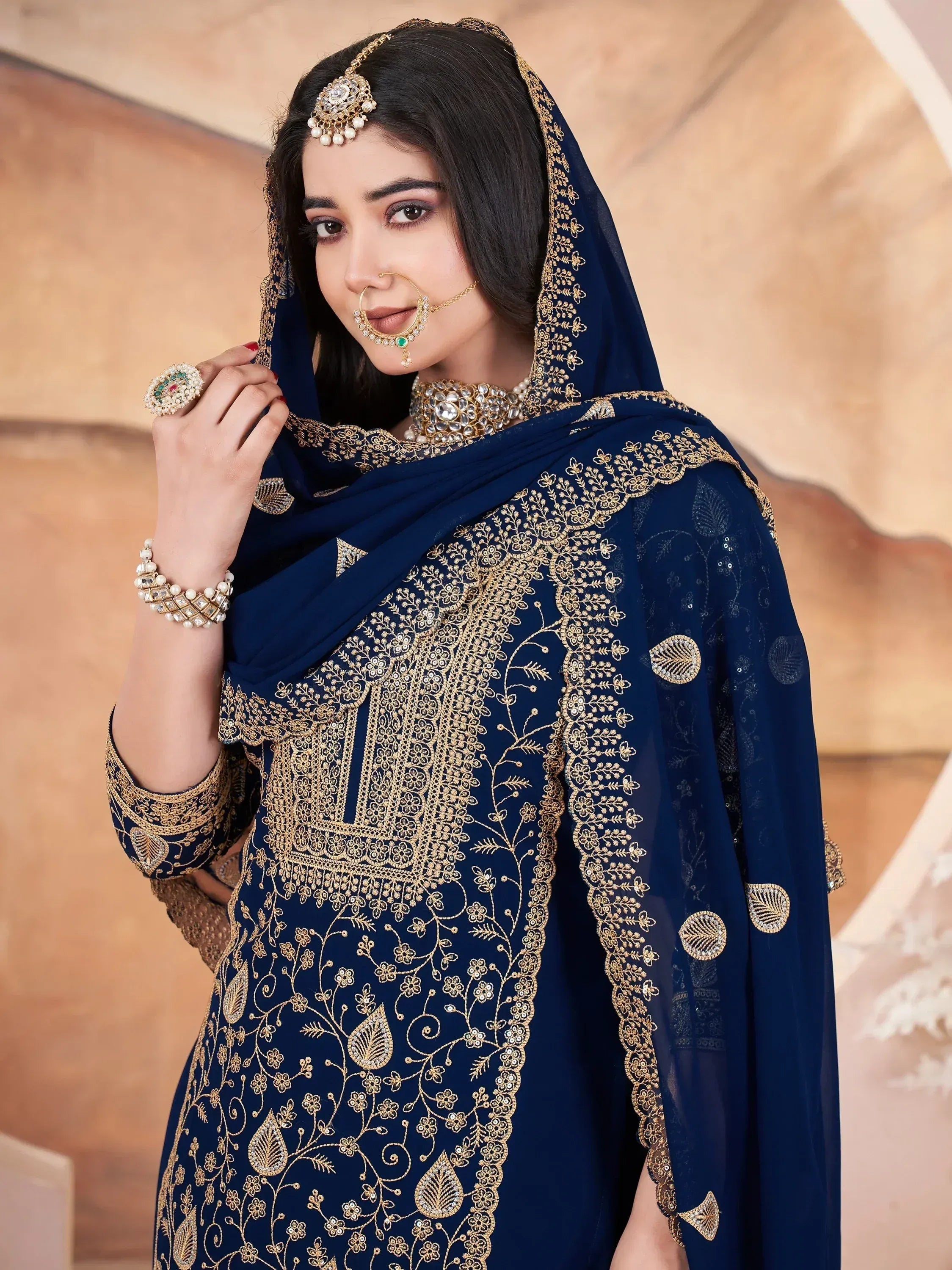 Navy blue embroidered salwar kameez with gold detailing, traditional Indian ethnic wear for women