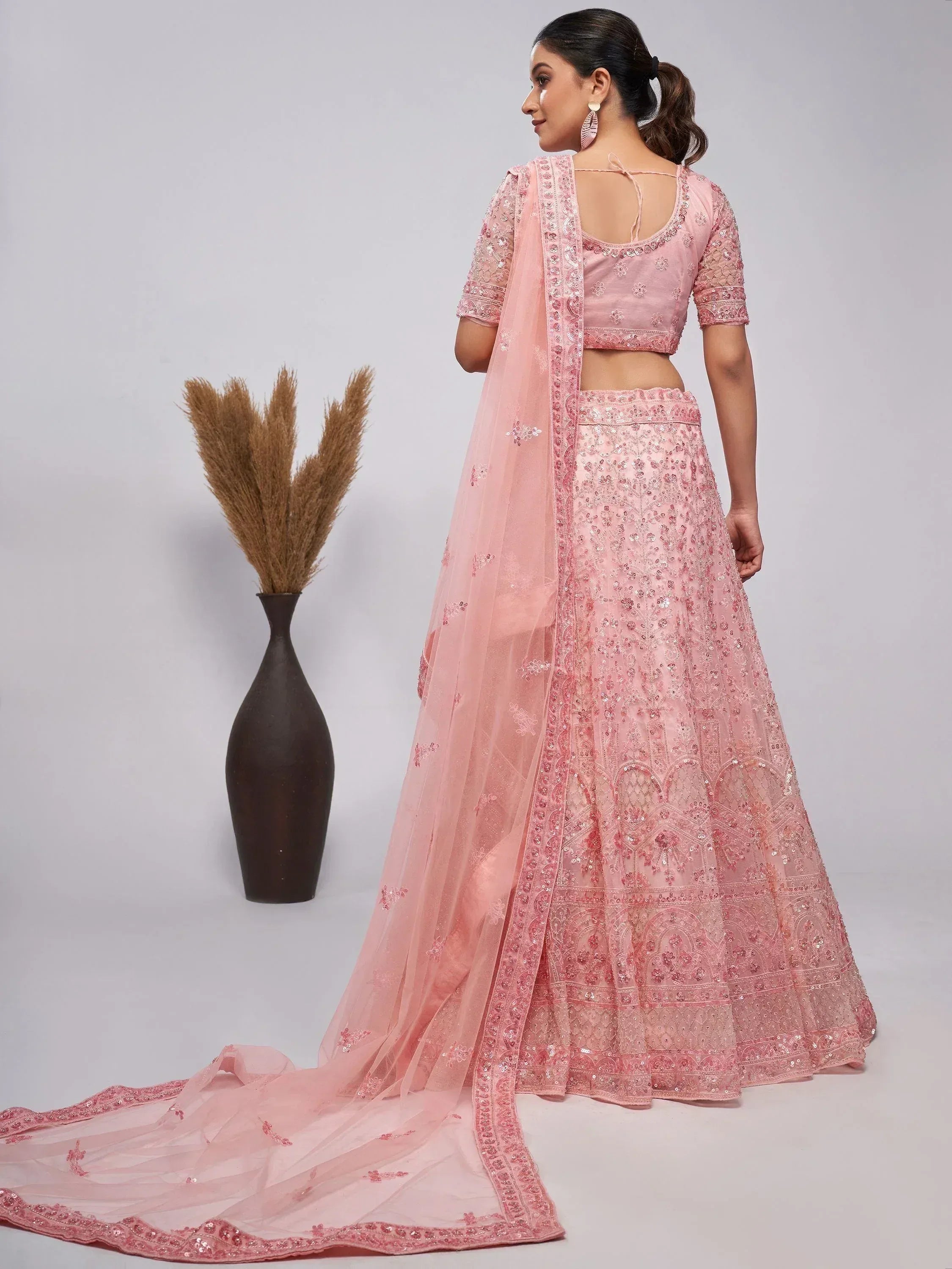 Pink embroidered lehenga choli with sheer dupatta, perfect for Indian ethnic wear occasions