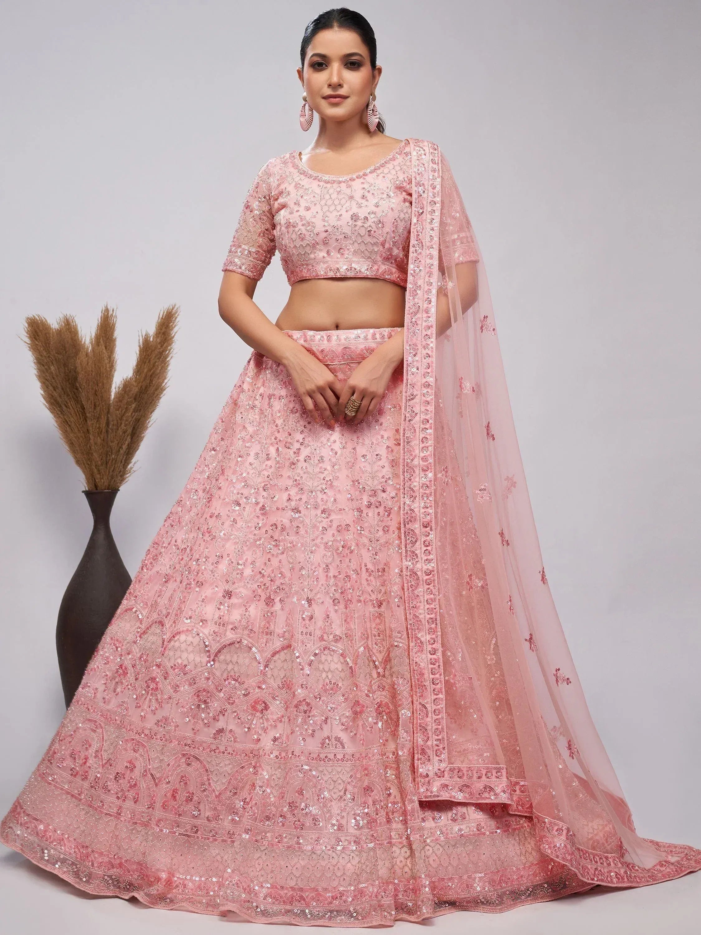 Pink embroidered lehenga choli with sequin work and matching dupatta, ideal for weddings and festive occasions