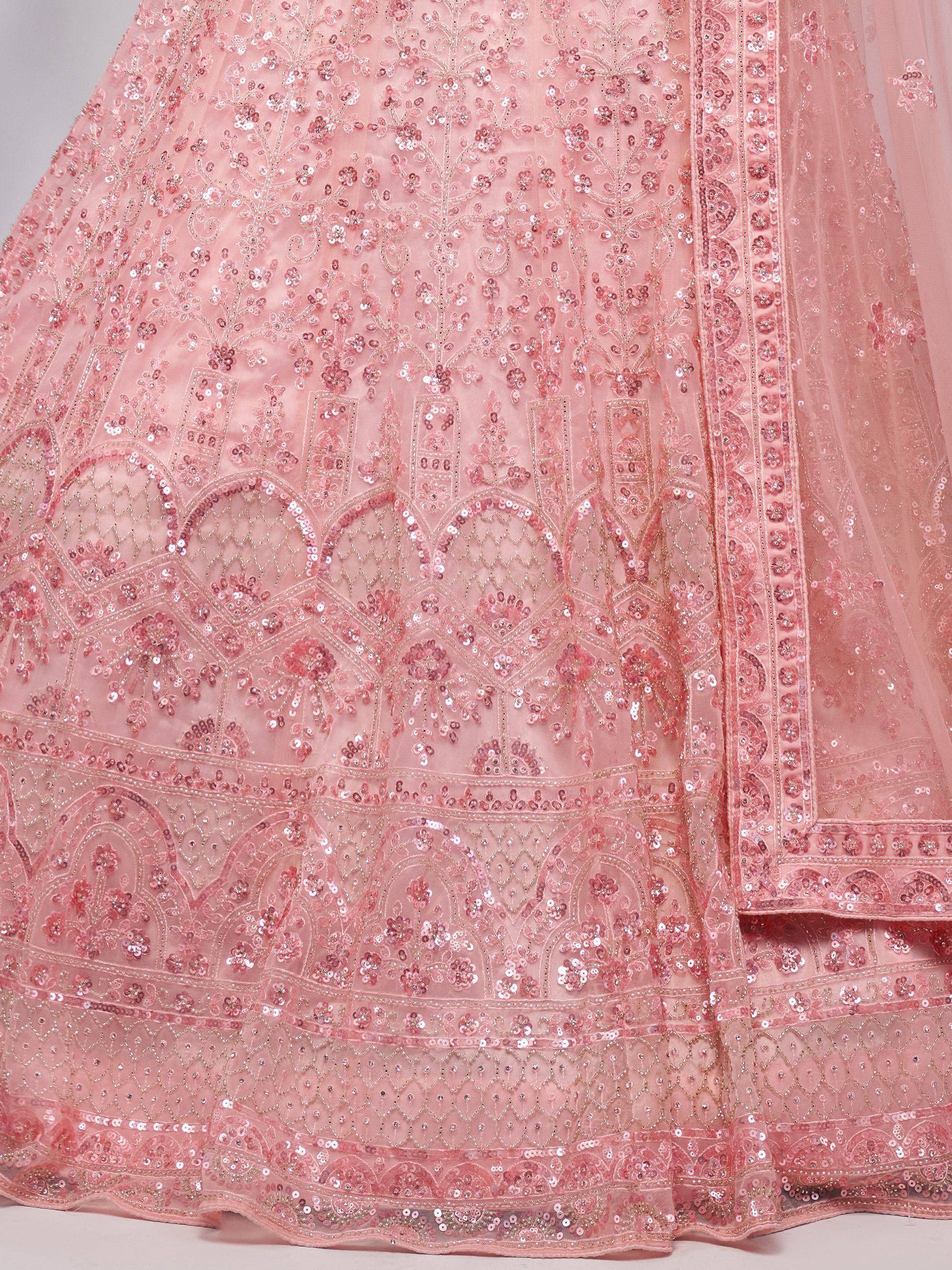 Pink sequin-embellished lehenga with intricate floral embroidery and net dupatta, perfect for Indian weddings and festive occasions.