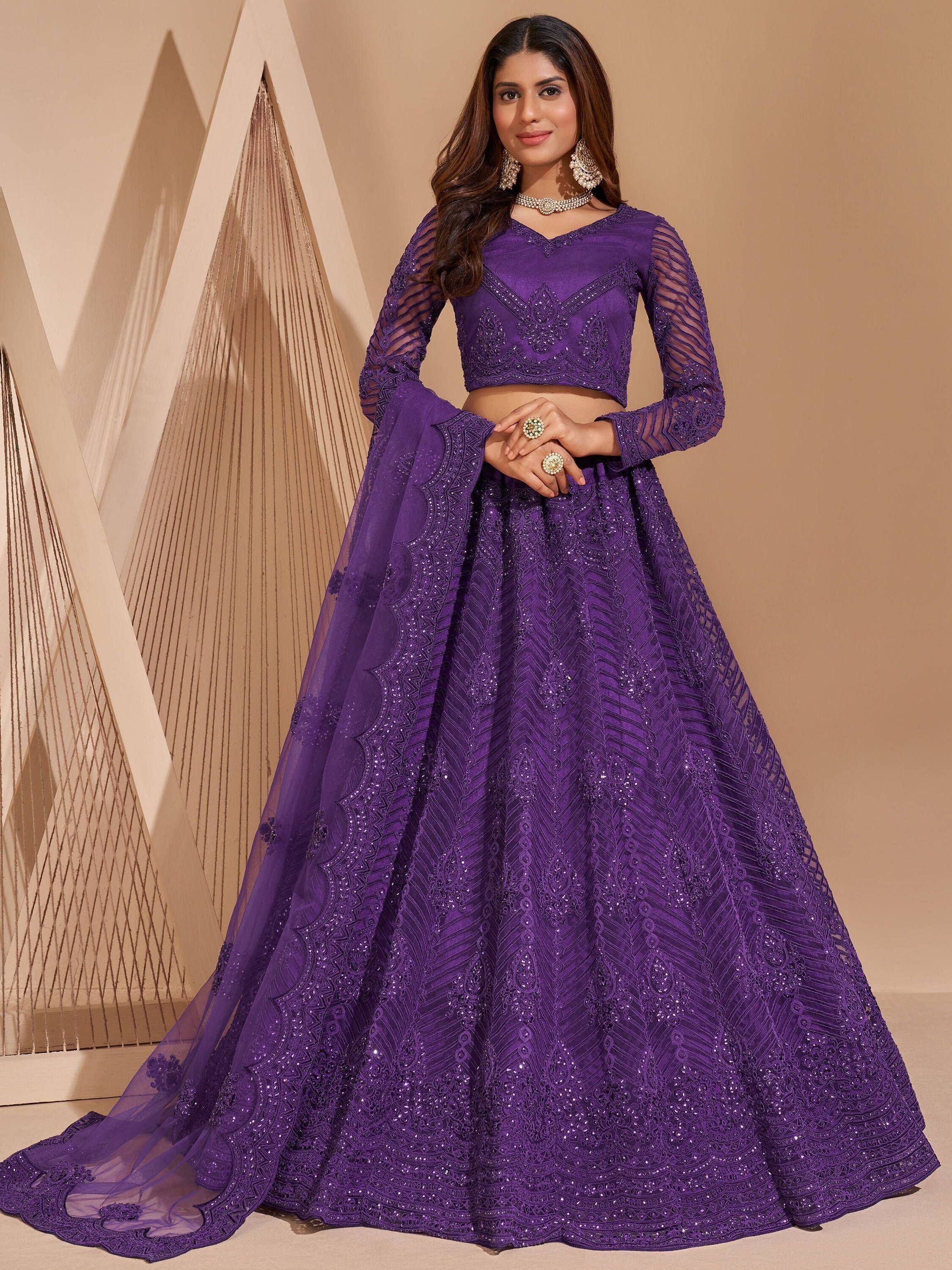 Purple embroidered lehenga choli with sheer sleeves and detailed skirt, perfect for Indian ethnic occasions