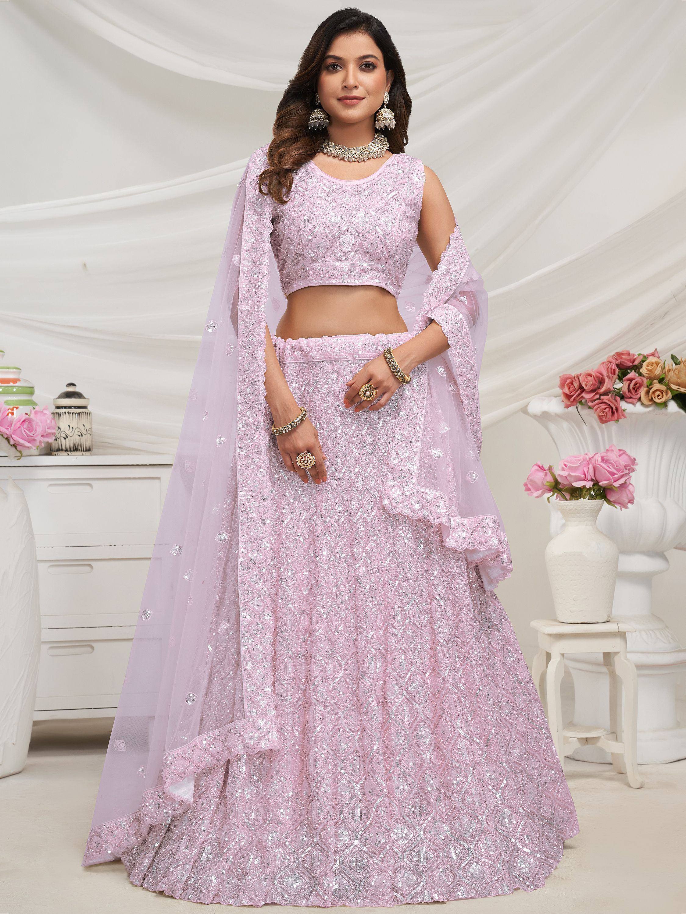 Pink sequined lehenga choli with sheer dupatta, perfect for Indian weddings and festive occasions