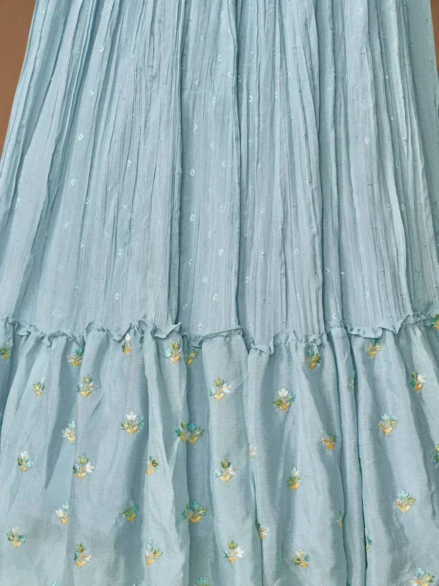 Light blue ethnic gown with floral embroidery and pleated design, perfect for Indian occasions