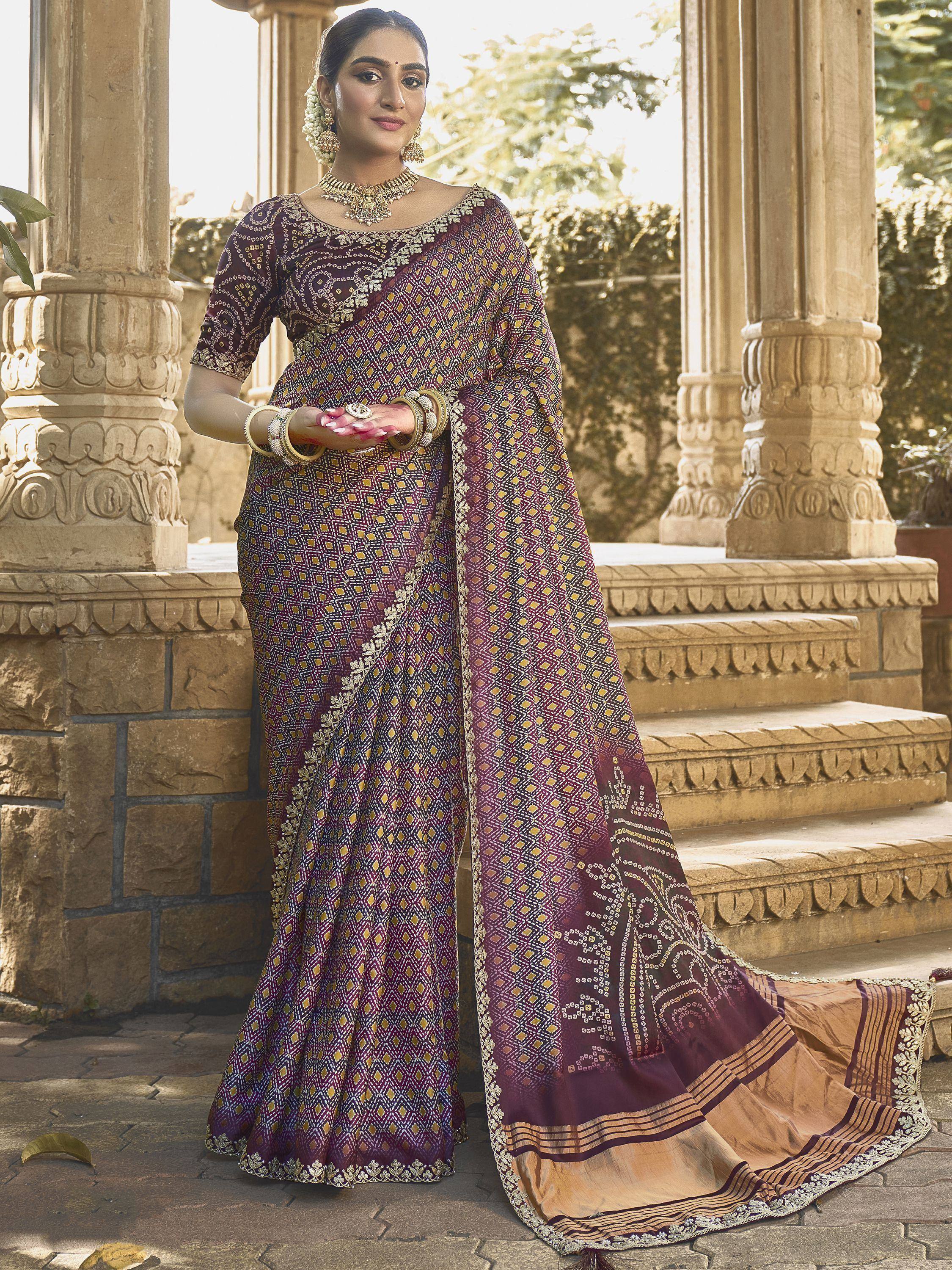 Elegant purple and gold printed saree with embroidery, perfect for Indian ethnic wear occasions