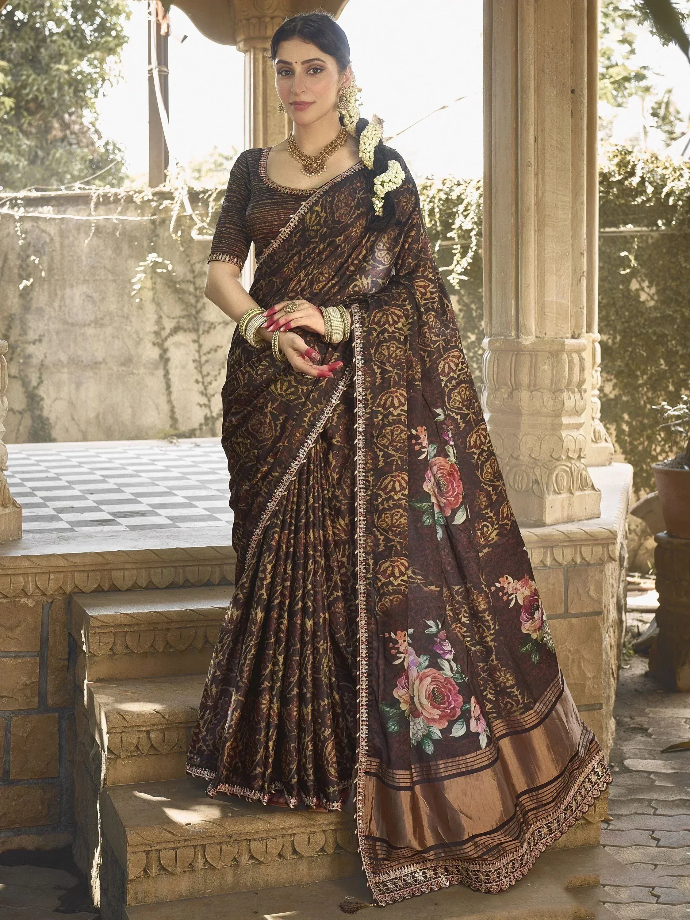 Elegant brown floral saree with gold embroidery, perfect for Indian ethnic wear occasions.