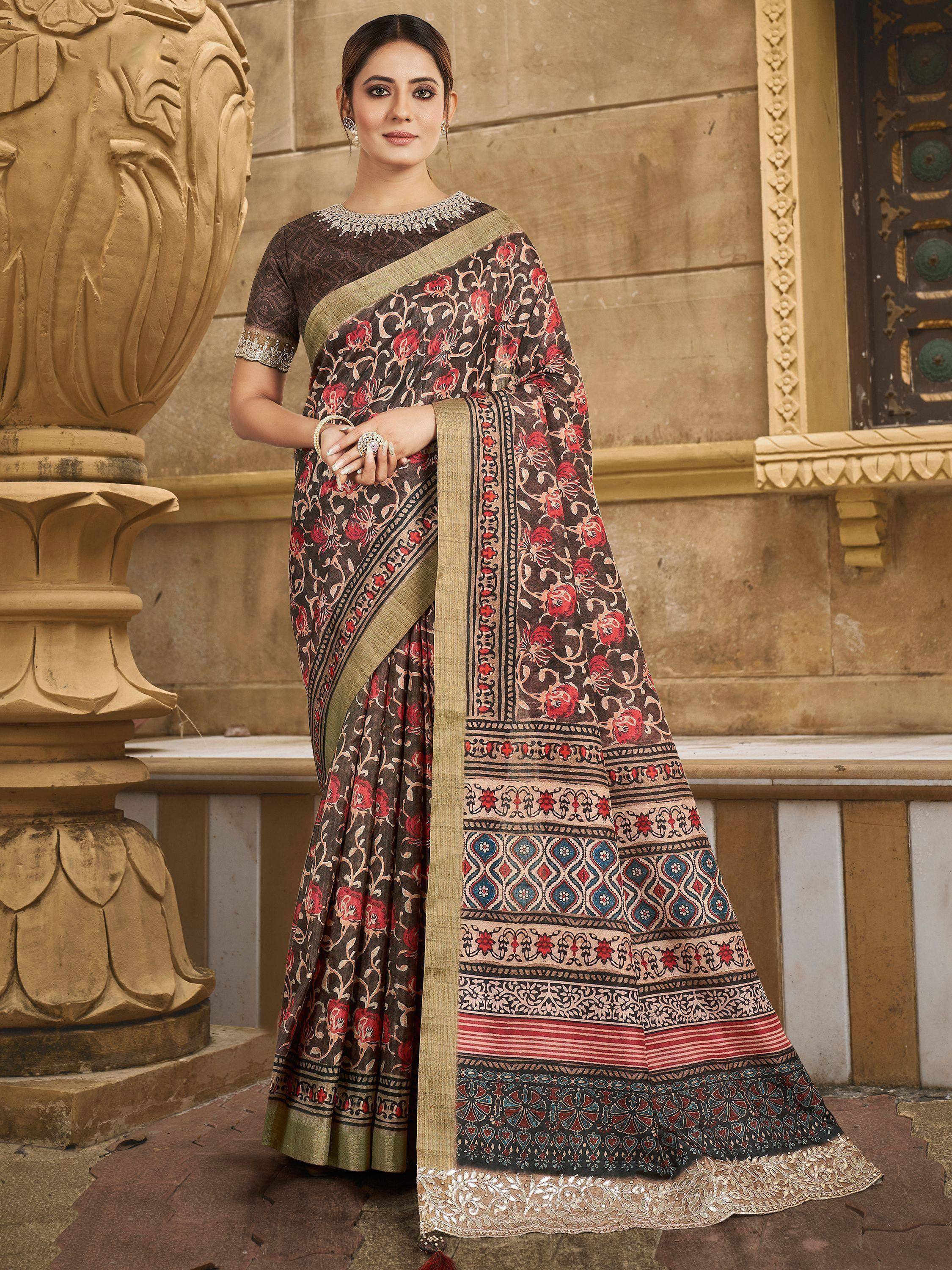 Woman in elegant floral print saree with embroidered border, perfect for Indian ethnic occasions