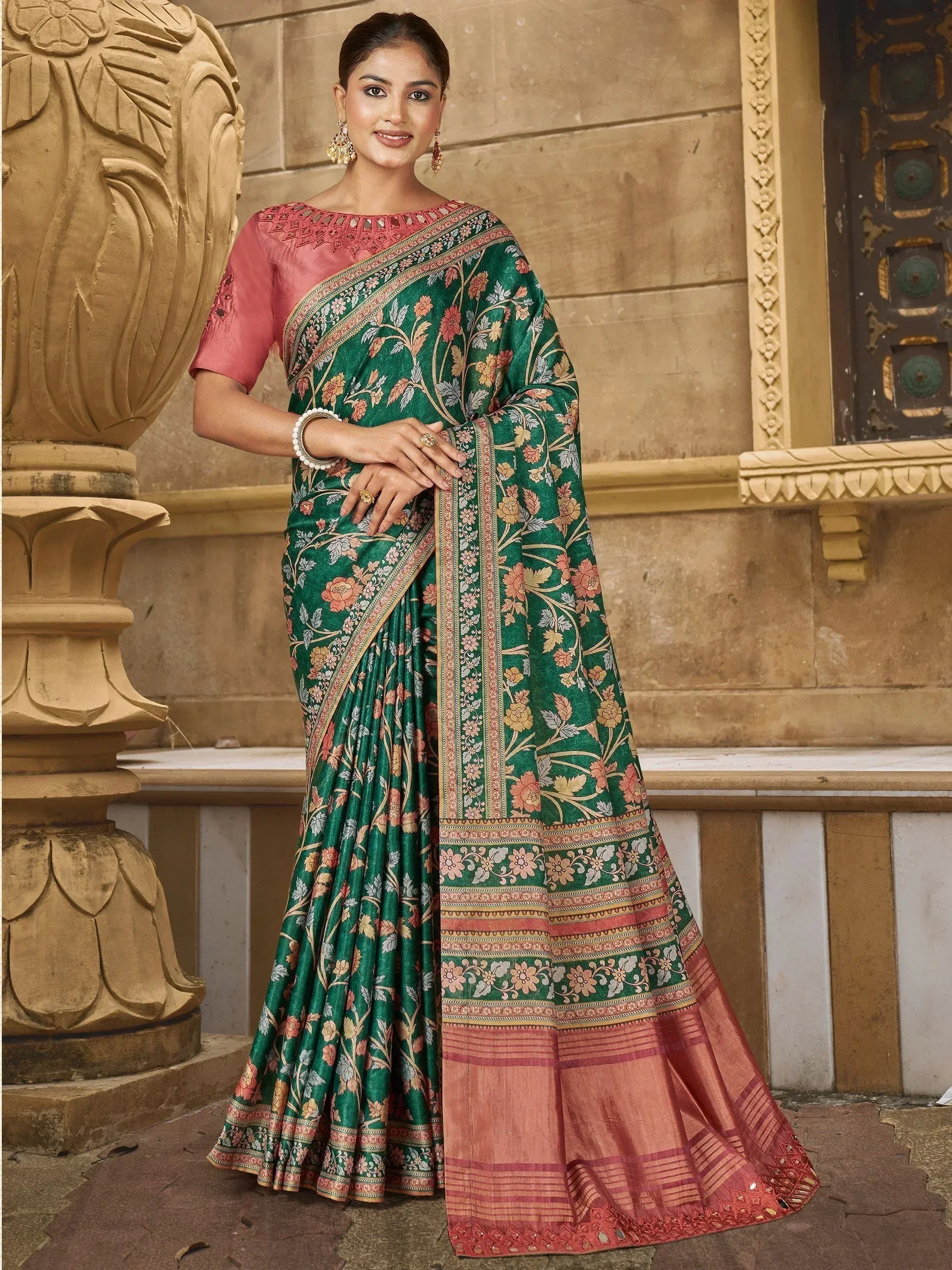 Woman in green floral saree with pink blouse, traditional Indian ethnic wear for festive occasions