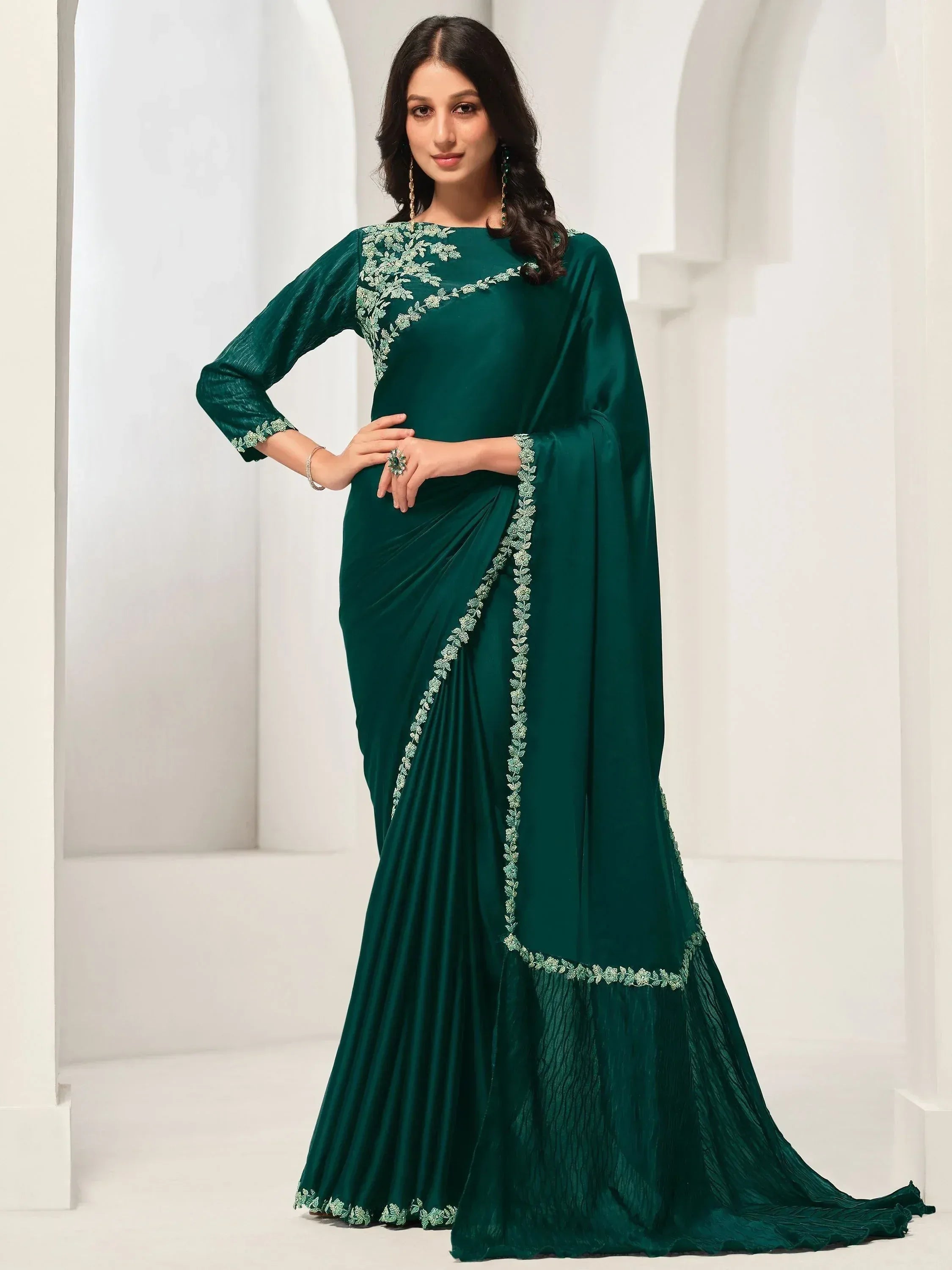 Emerald green designer saree with floral embroidery, perfect for Indian ethnic occasions