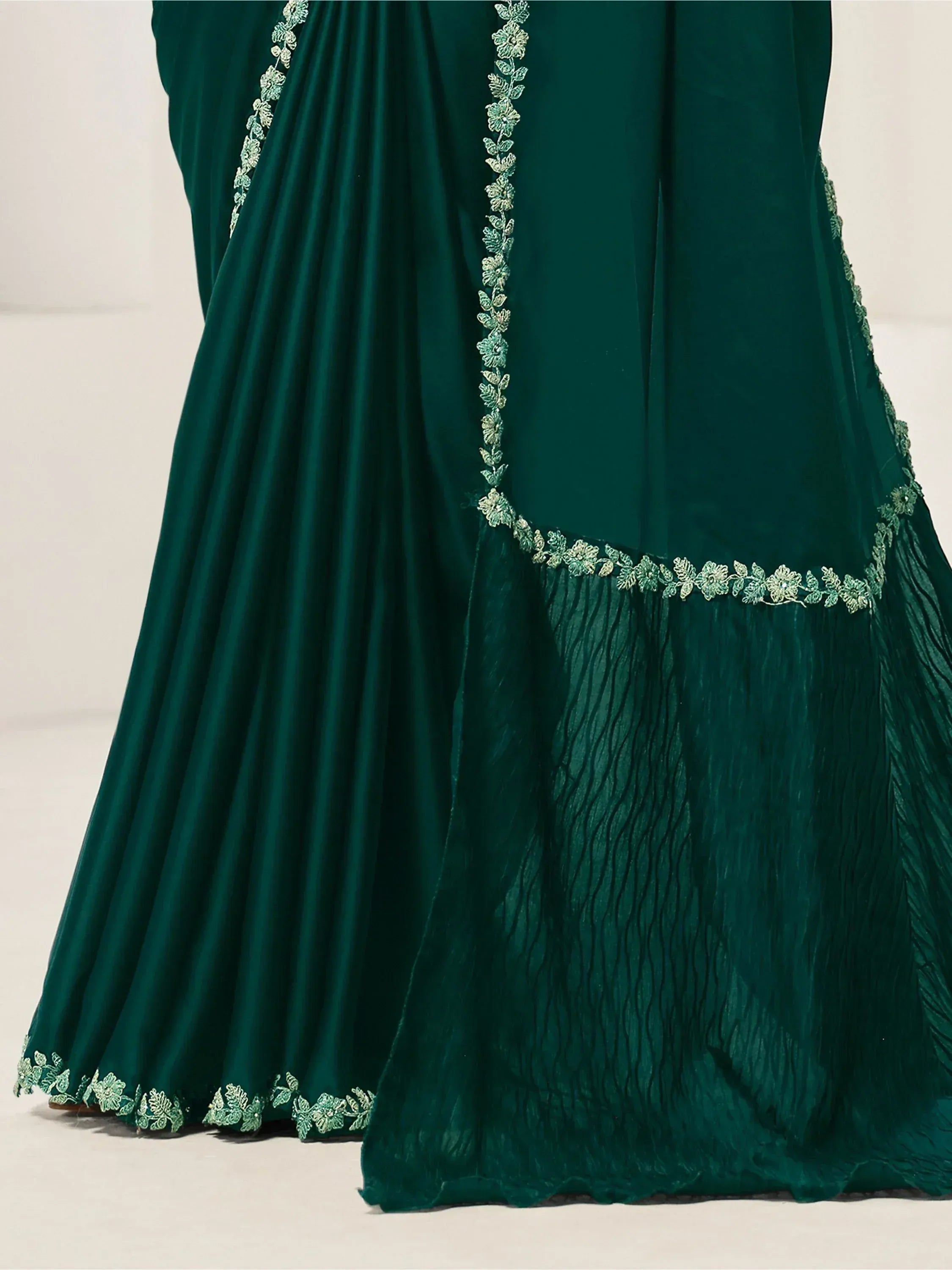 Emerald green ethnic gown with floral embroidery and pleated detailing
