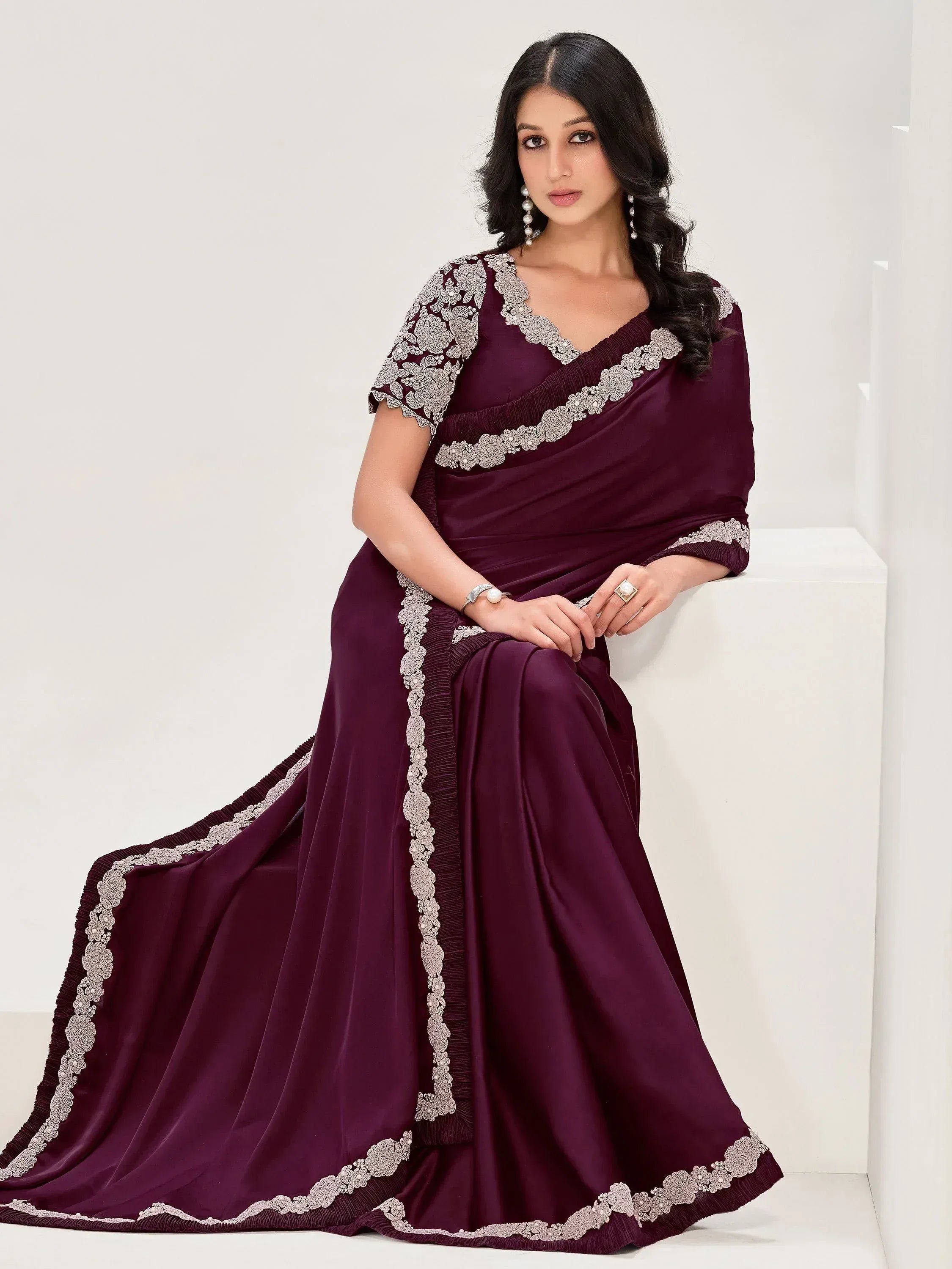 Elegant maroon saree with silver floral embroidery, perfect for Indian ethnic occasions and festive wear.