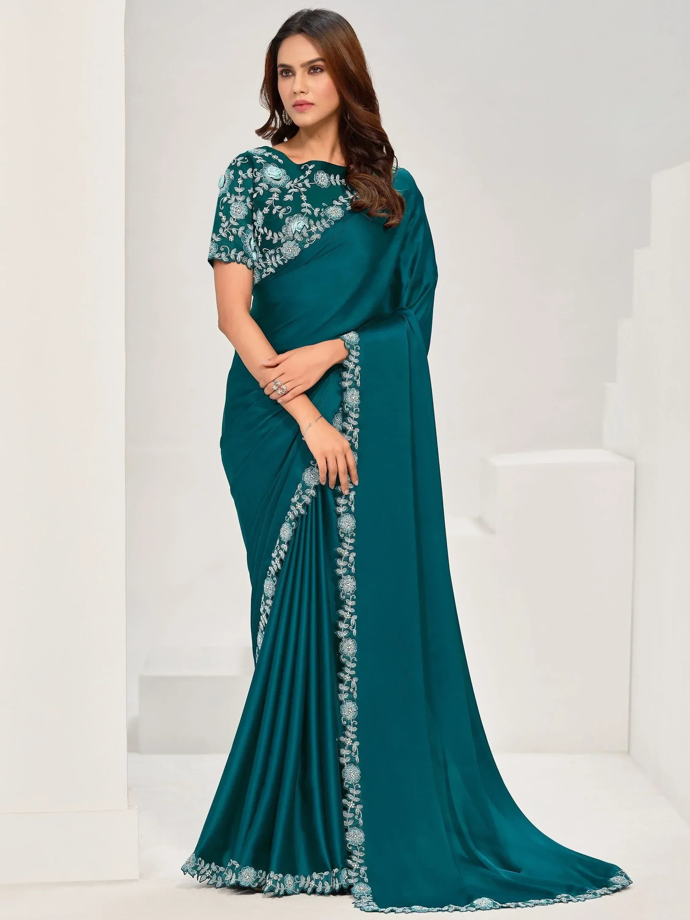 Teal designer saree with floral embroidery, perfect for Indian ethnic wear occasions