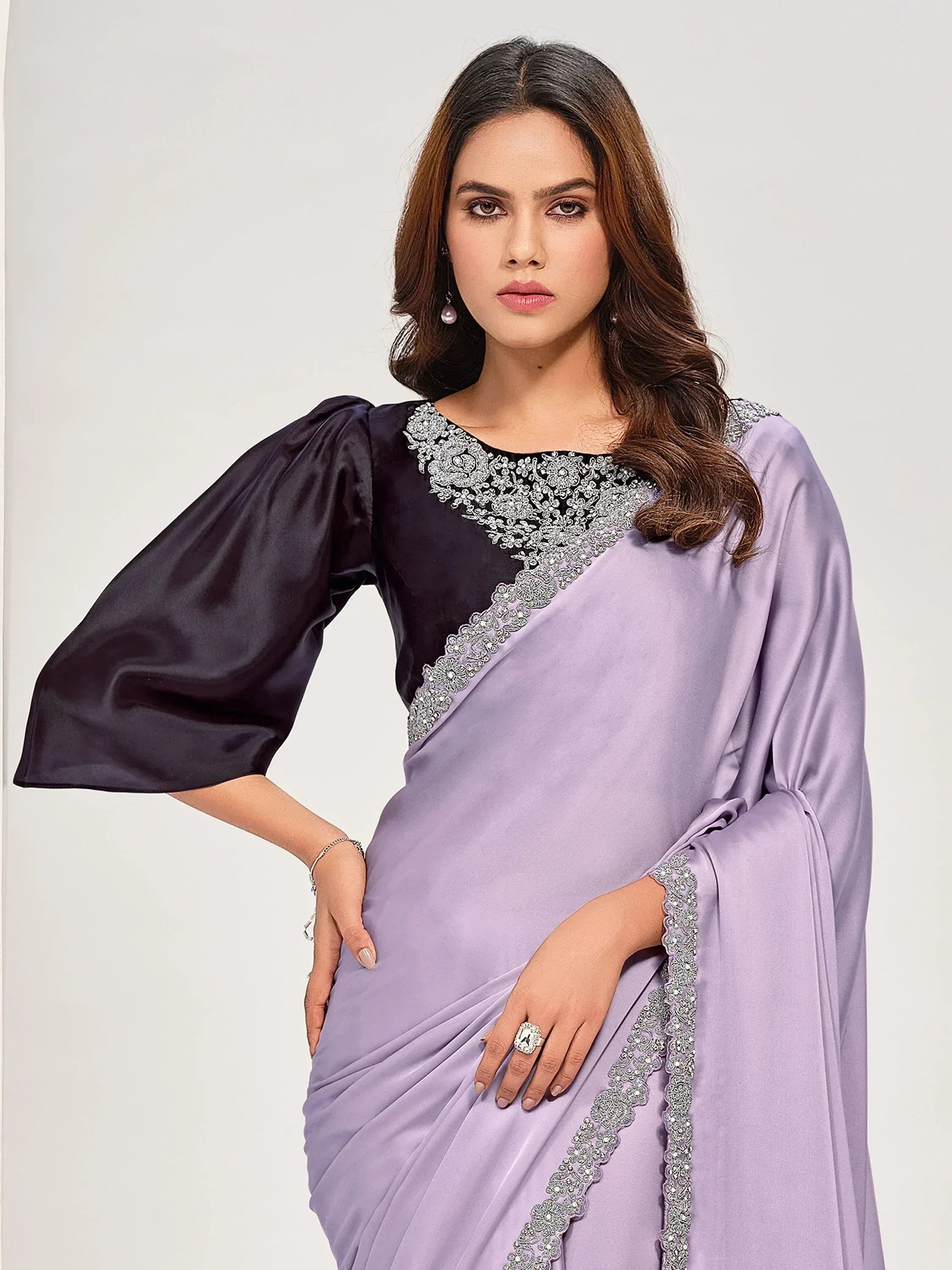 Lavender saree with black blouse, silver embroidery, and puff sleeves for ethnic wear