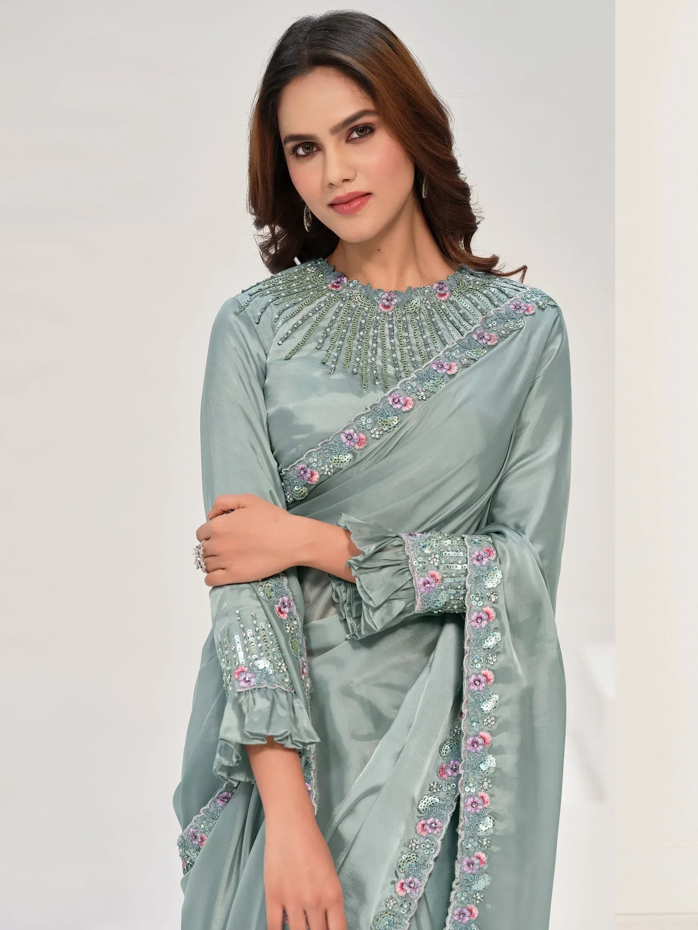 Elegant sage green ethnic gown with floral sequin embroidery and ruffled sleeves for Indian wear