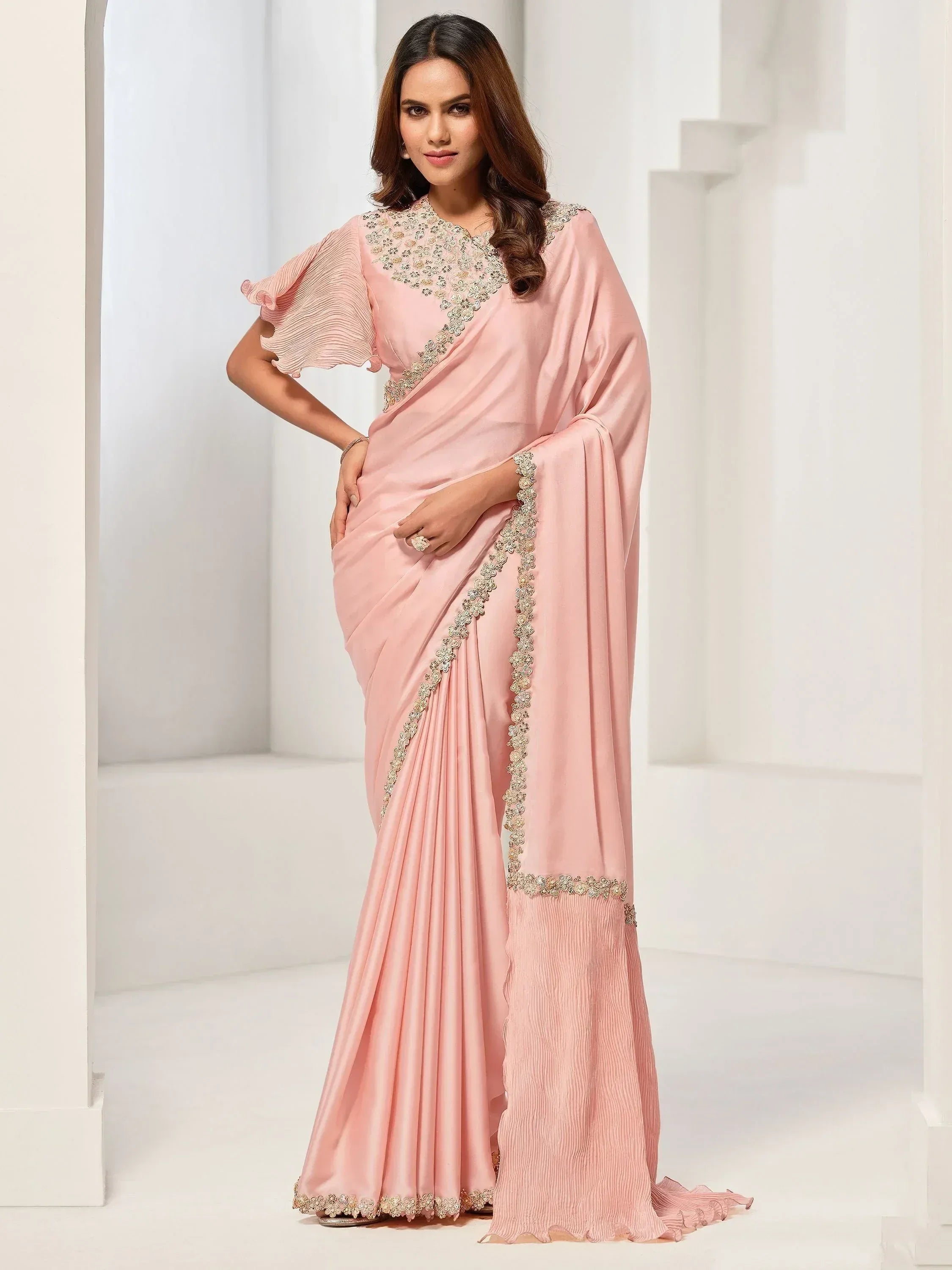 Pink designer saree with gold embroidery and ruffled sleeves, elegant Indian ethnic wear