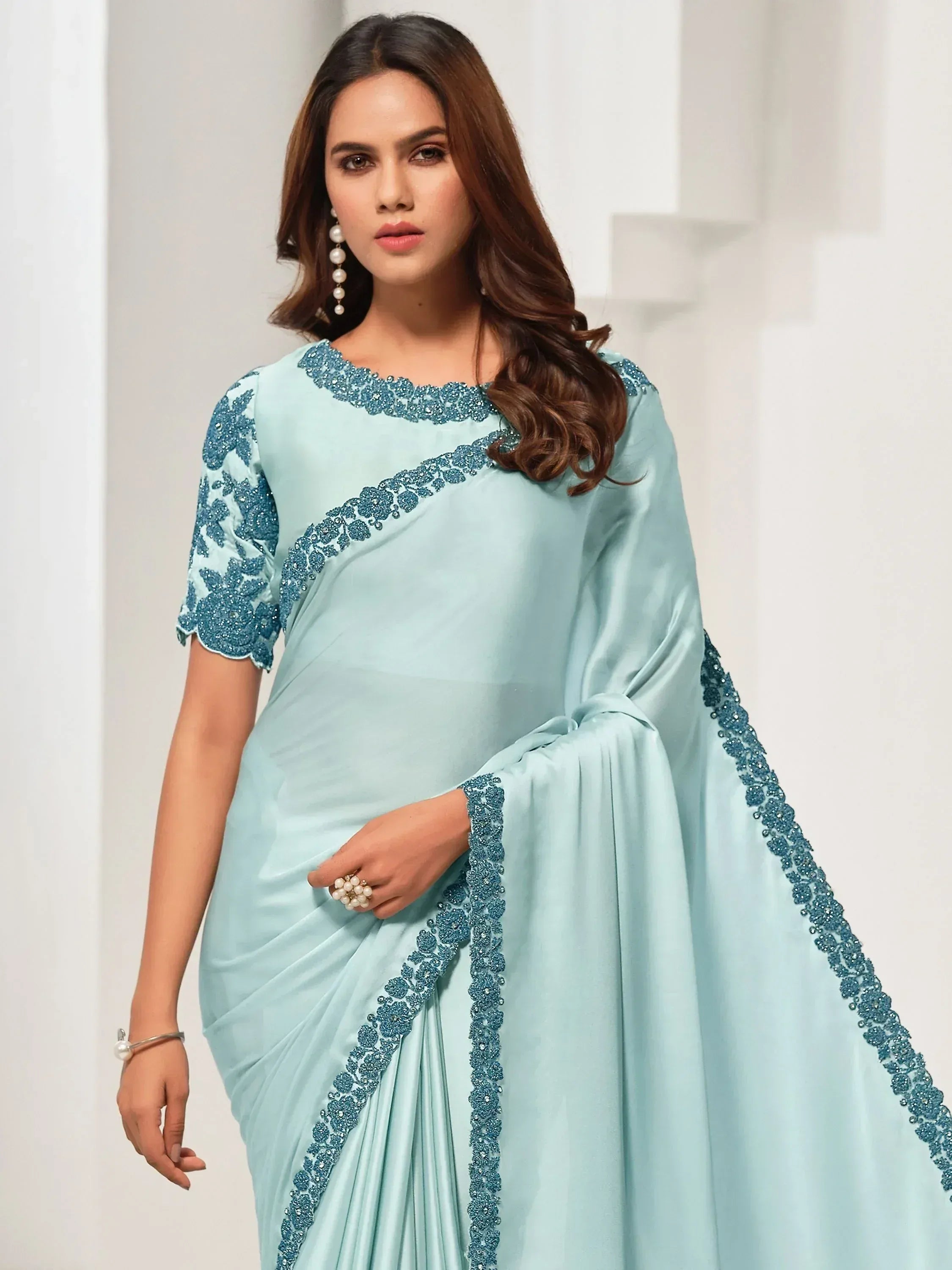 Light blue designer saree with floral embroidery and sequin detailing for ethnic wear