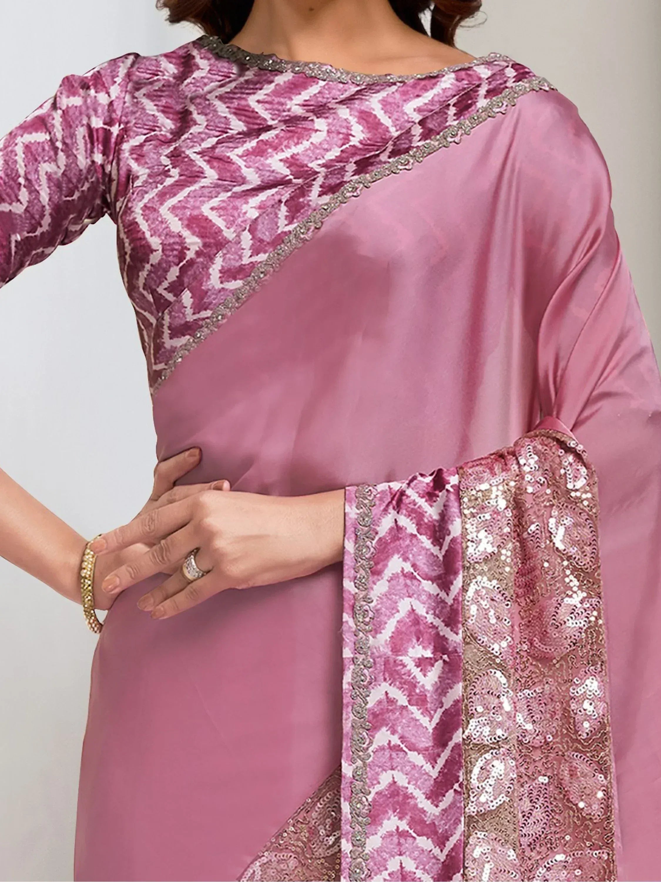Pink ethnic salwar kameez with geometric print and sequin dupatta, perfect for festive occasions