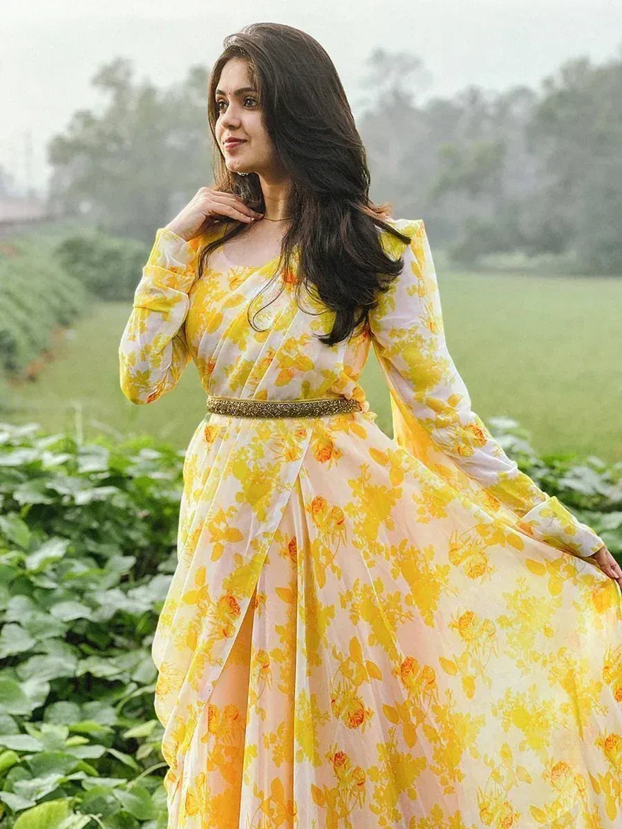 Yellow floral ethnic gown with long sleeves and embroidered belt, perfect for Indian occasions