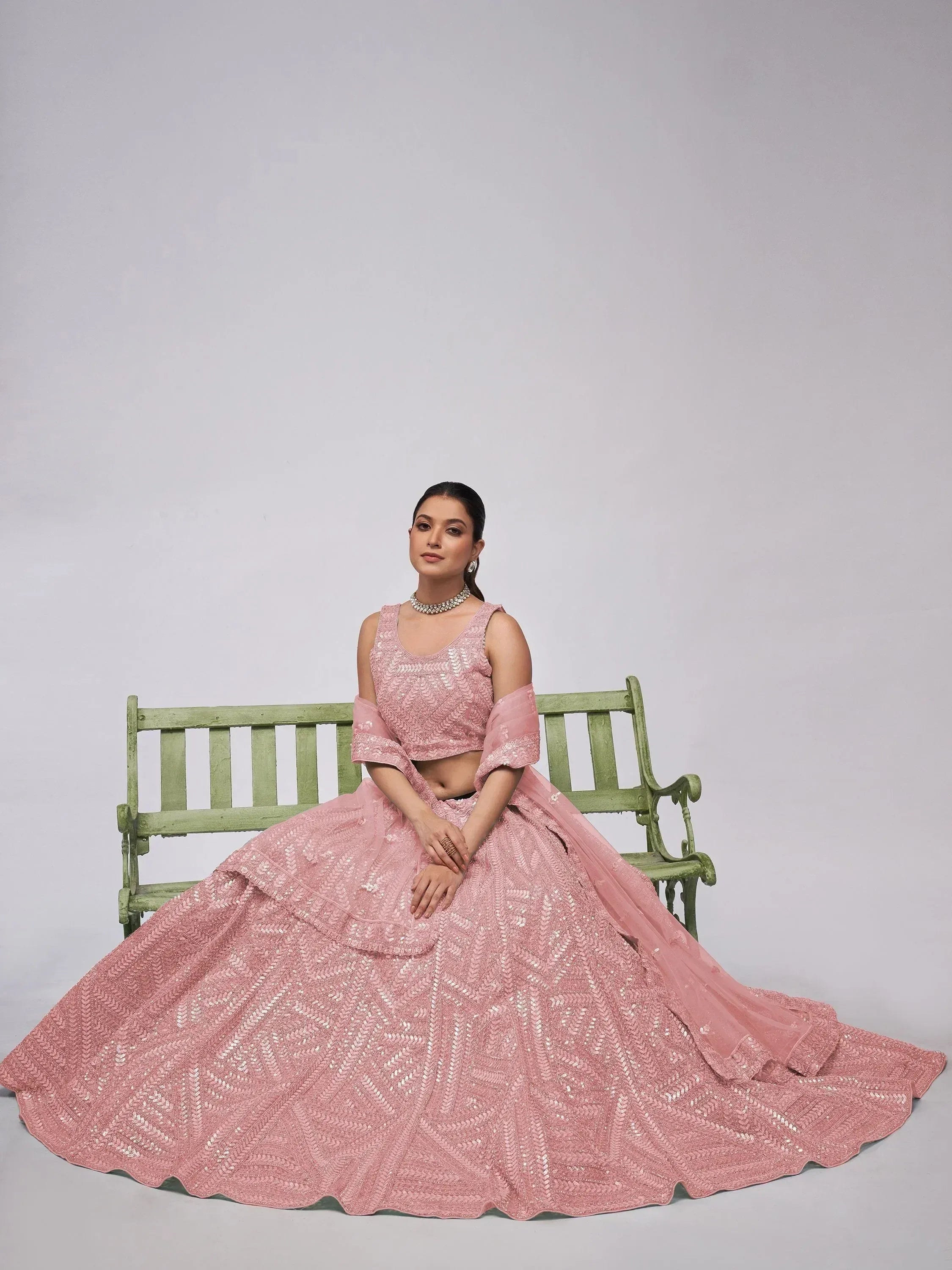 Pink sequined lehenga choli with flared skirt, perfect for Indian ethnic wear and festive occasions