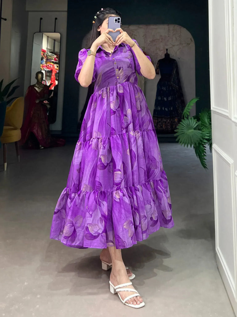 Purple floral tiered ethnic gown with puff sleeves, perfect for Indian occasions and festive wear.