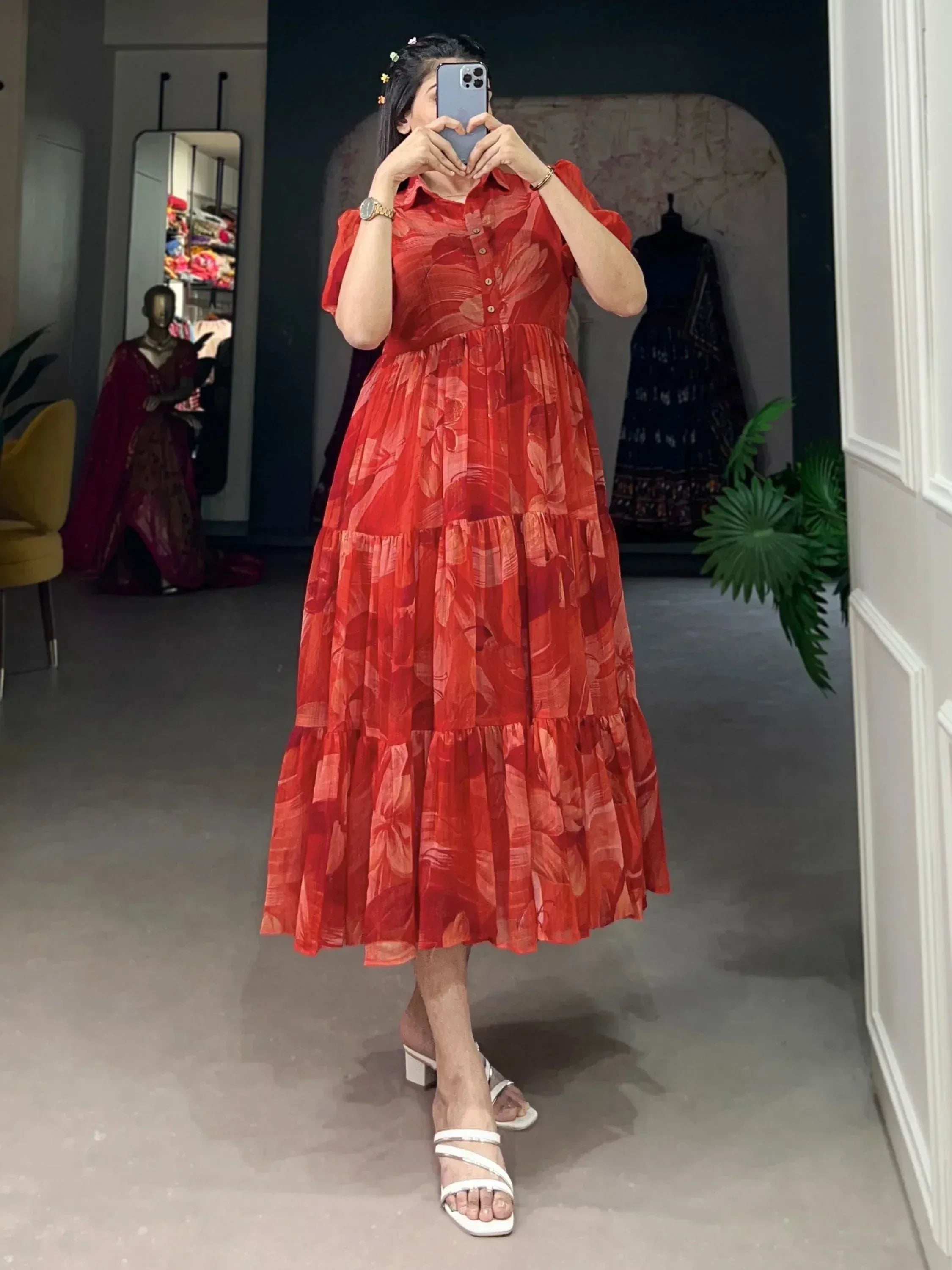 Red floral tiered ethnic gown with puff sleeves, perfect for Indian occasions and festive wear.
