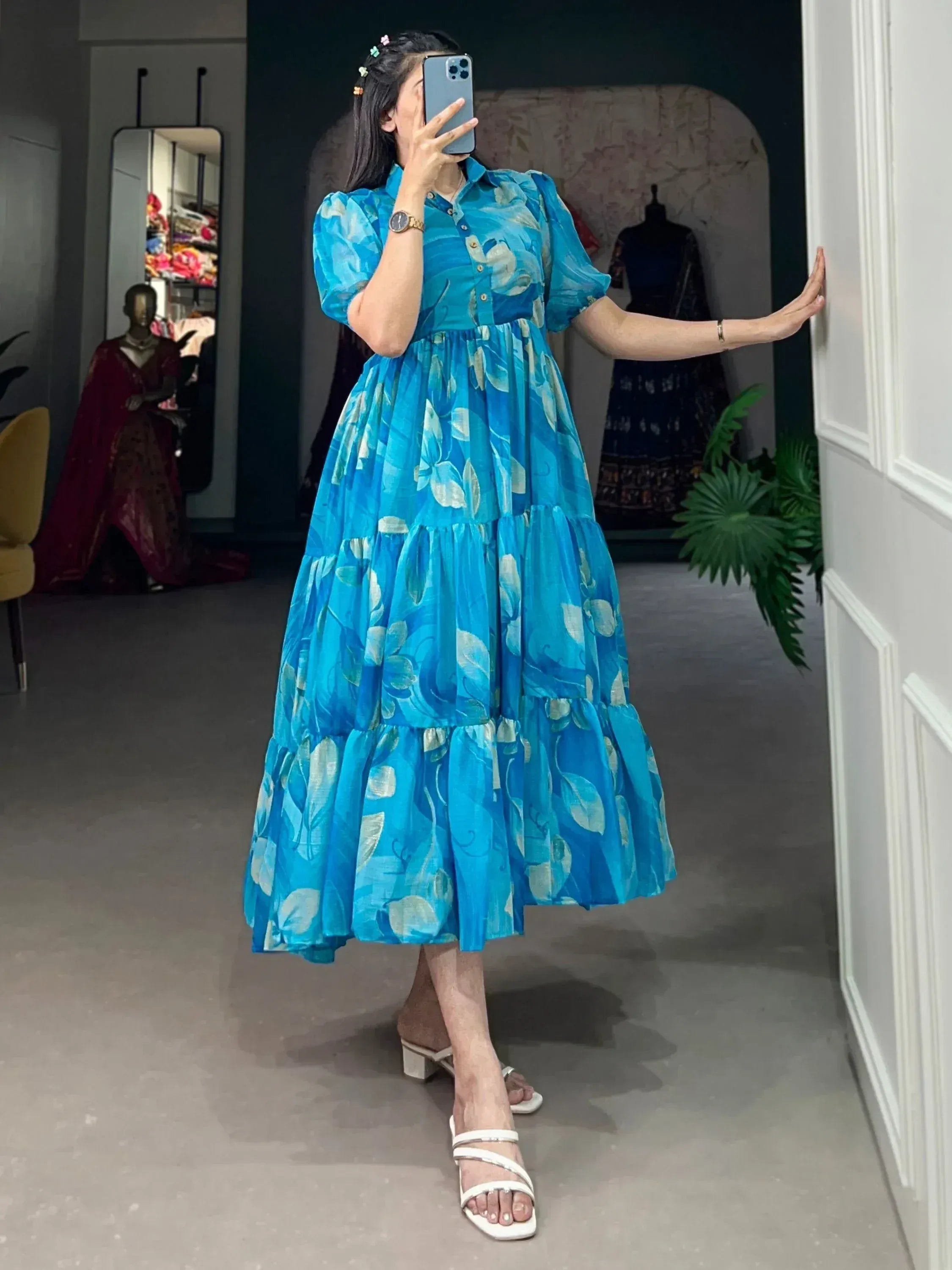 Blue floral tiered ethnic gown with puff sleeves, perfect for Indian occasions and festive wear.