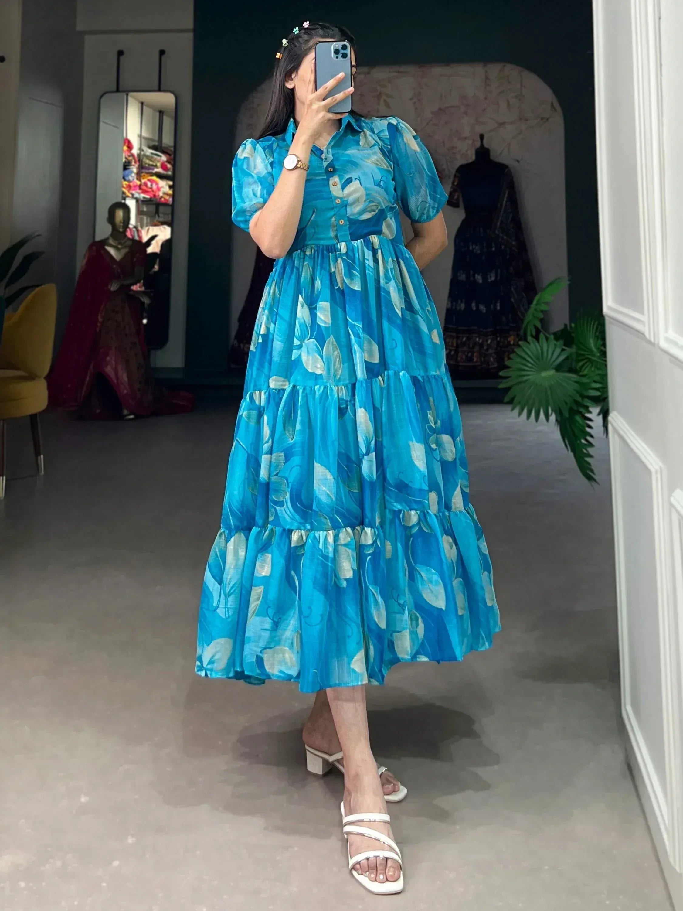 Blue floral tiered ethnic gown with puff sleeves, perfect for Indian occasions and festive wear.