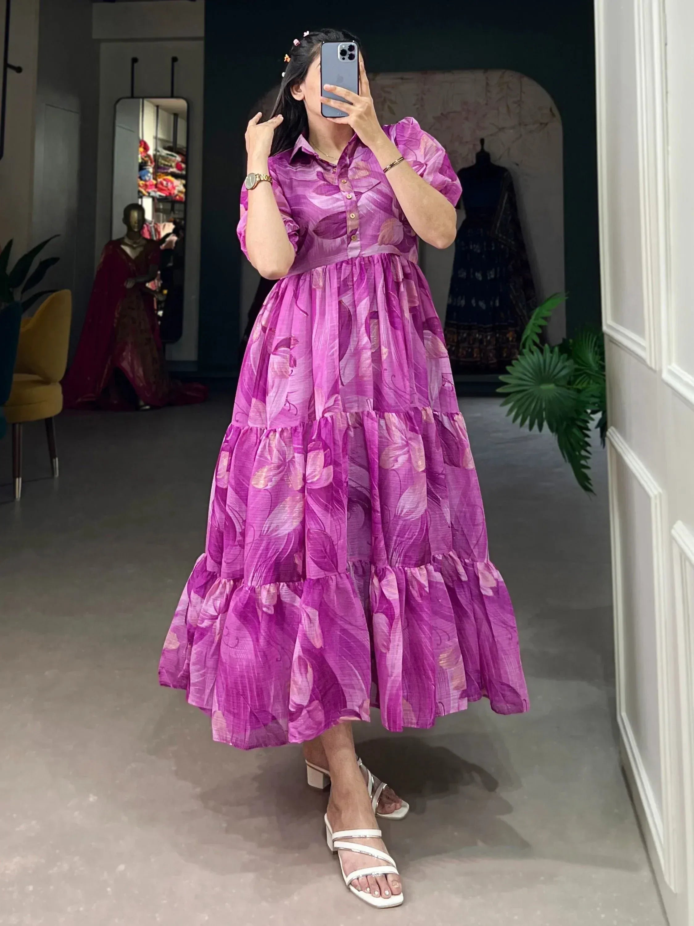 Purple floral tiered ethnic gown with puff sleeves, perfect for Indian occasions and festive wear.