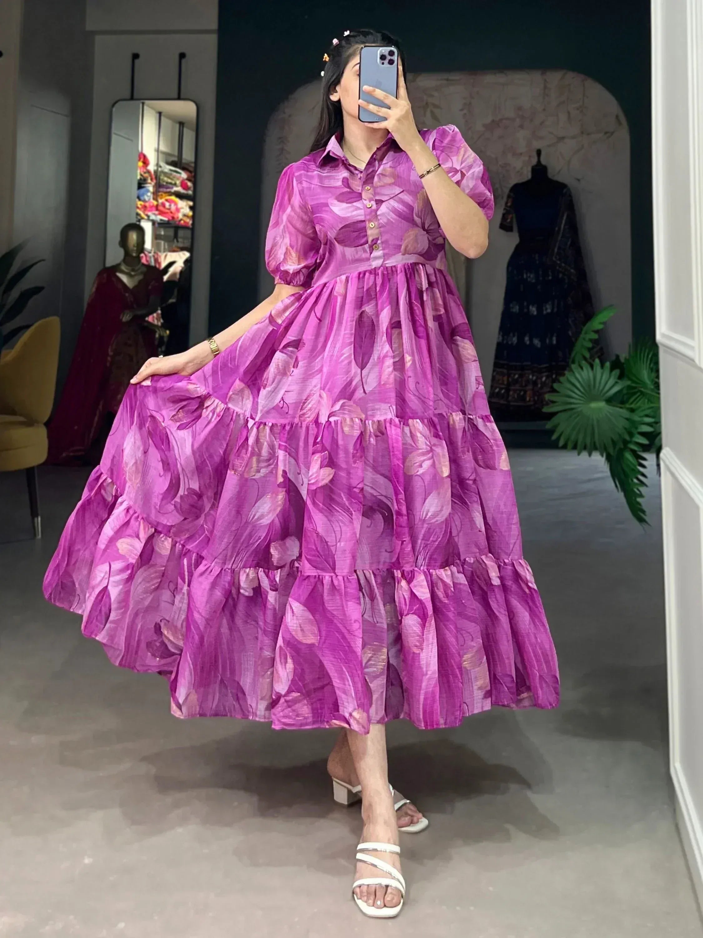 Purple floral tiered ethnic gown with puff sleeves, perfect for Indian occasions and festive wear.