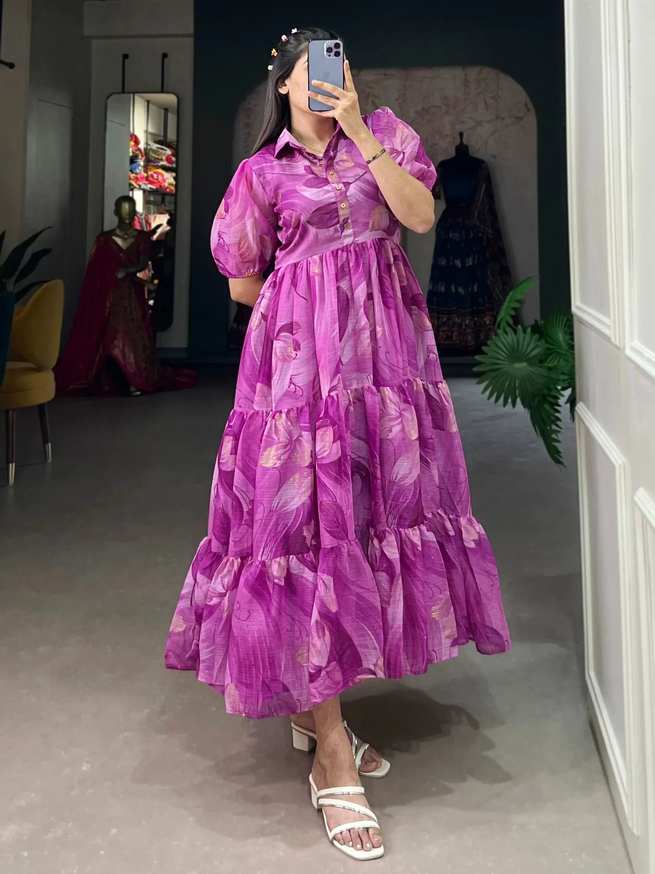 Purple floral tiered ethnic gown with puff sleeves, perfect for Indian occasions and festive wear.
