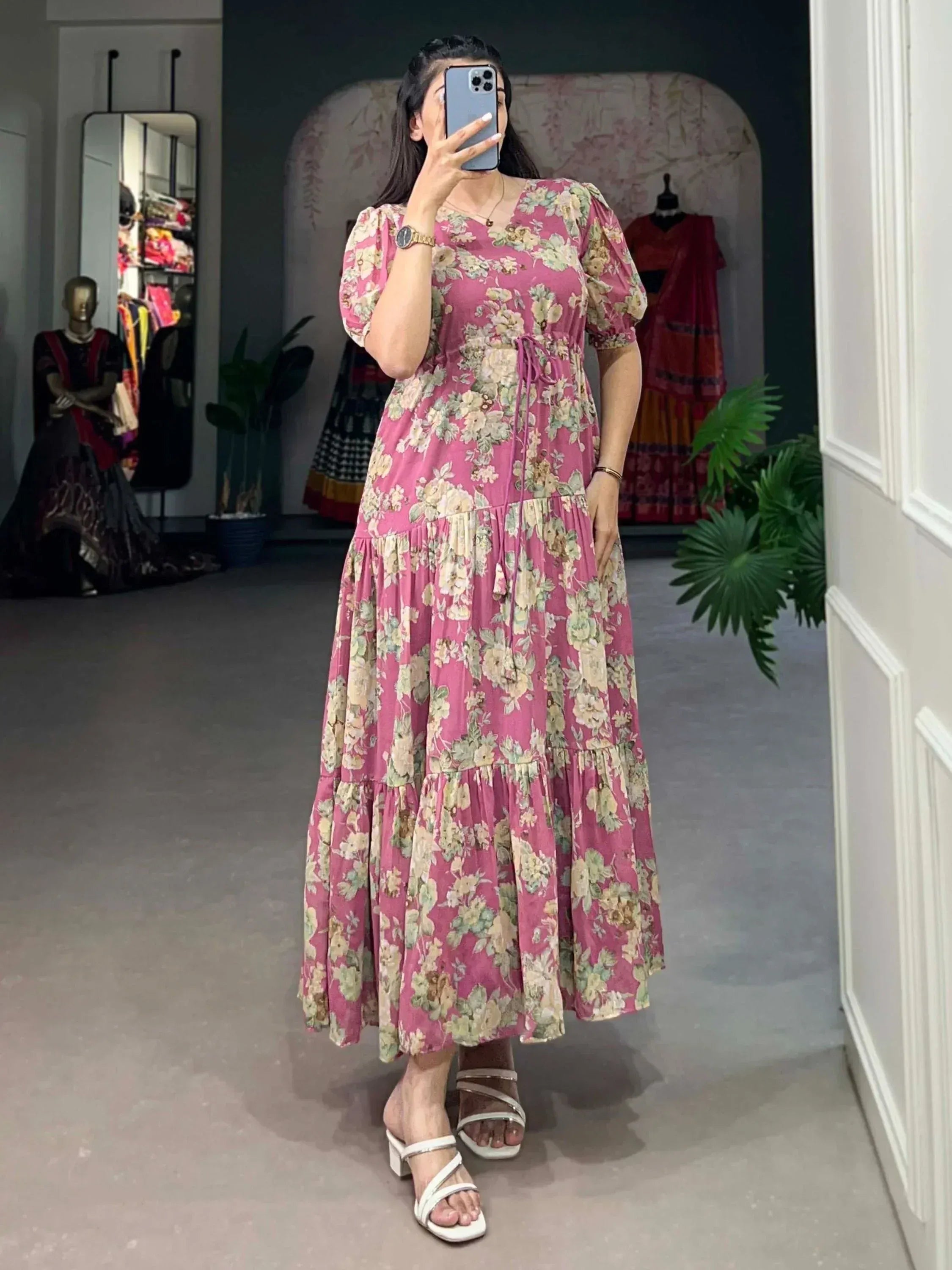 Pink floral ethnic gown with tiered skirt and puff sleeves, perfect for Indian occasions