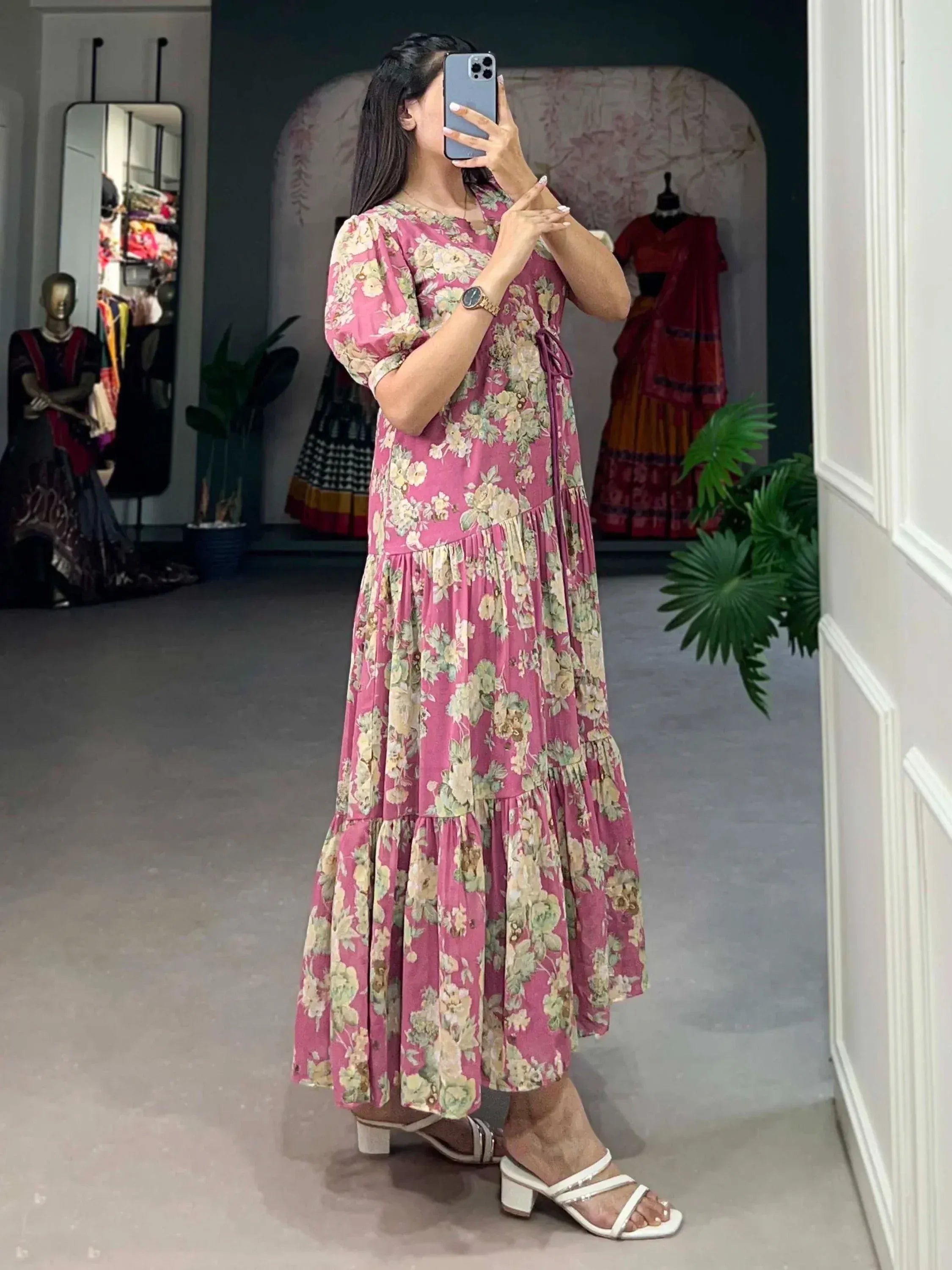 Pink floral tiered ethnic gown with puff sleeves, perfect for Indian occasions and festive wear.