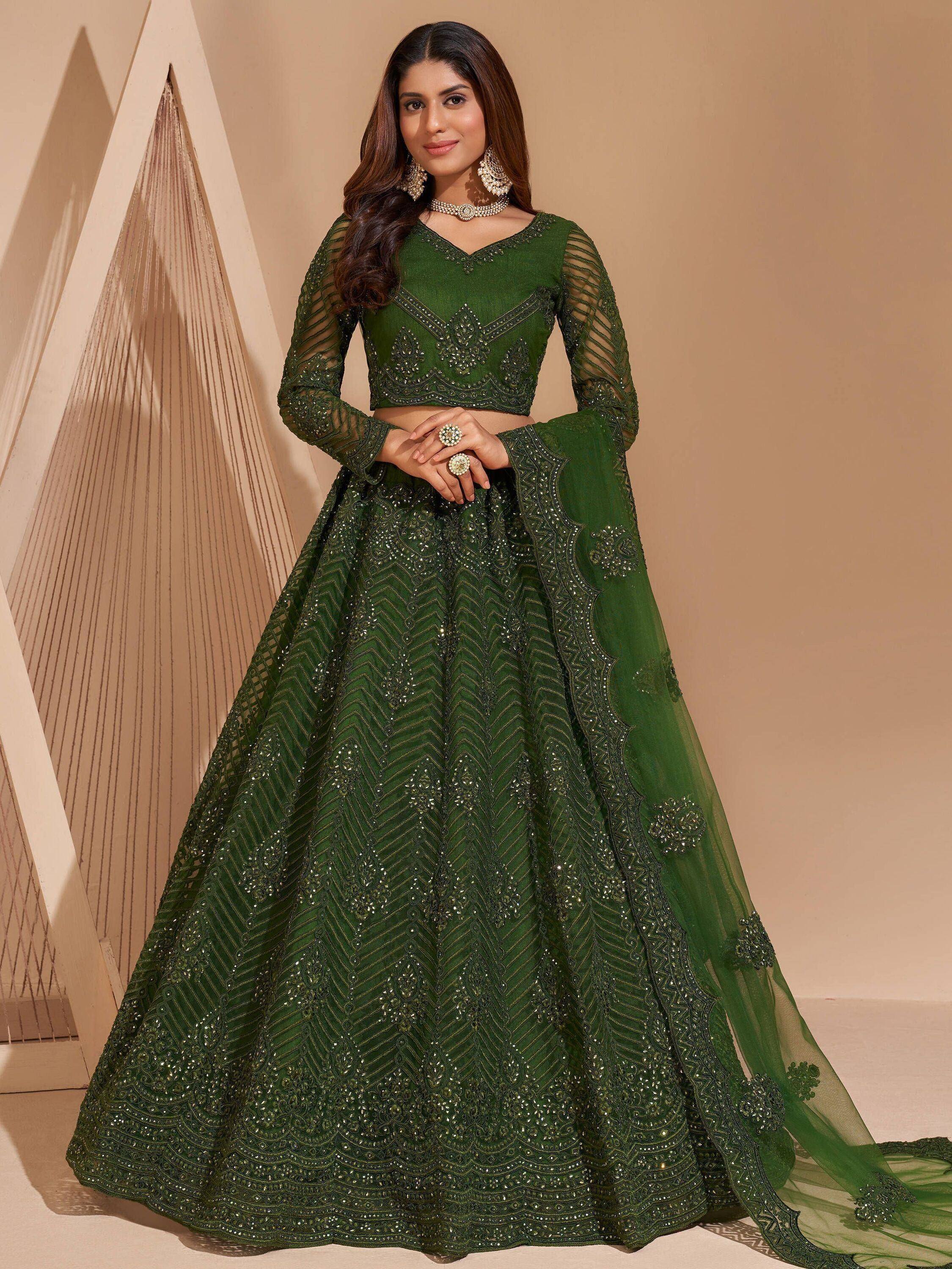 Emerald green designer lehenga choli with heavy embroidery and sheer sleeves for weddings
