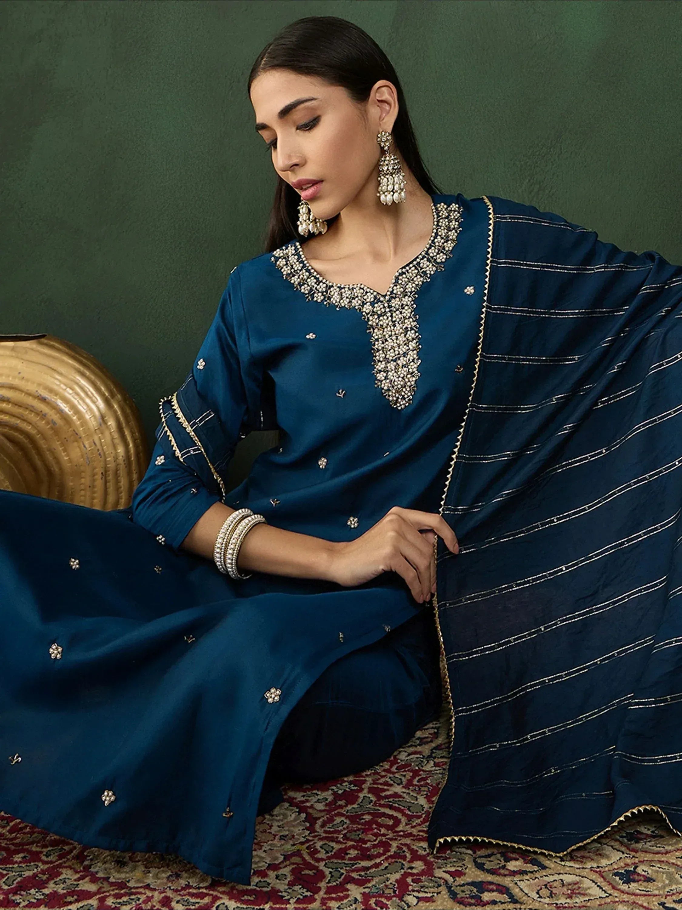 Elegant navy blue salwar kameez with pearl embroidery and striped dupatta, perfect for Indian ethnic wear.