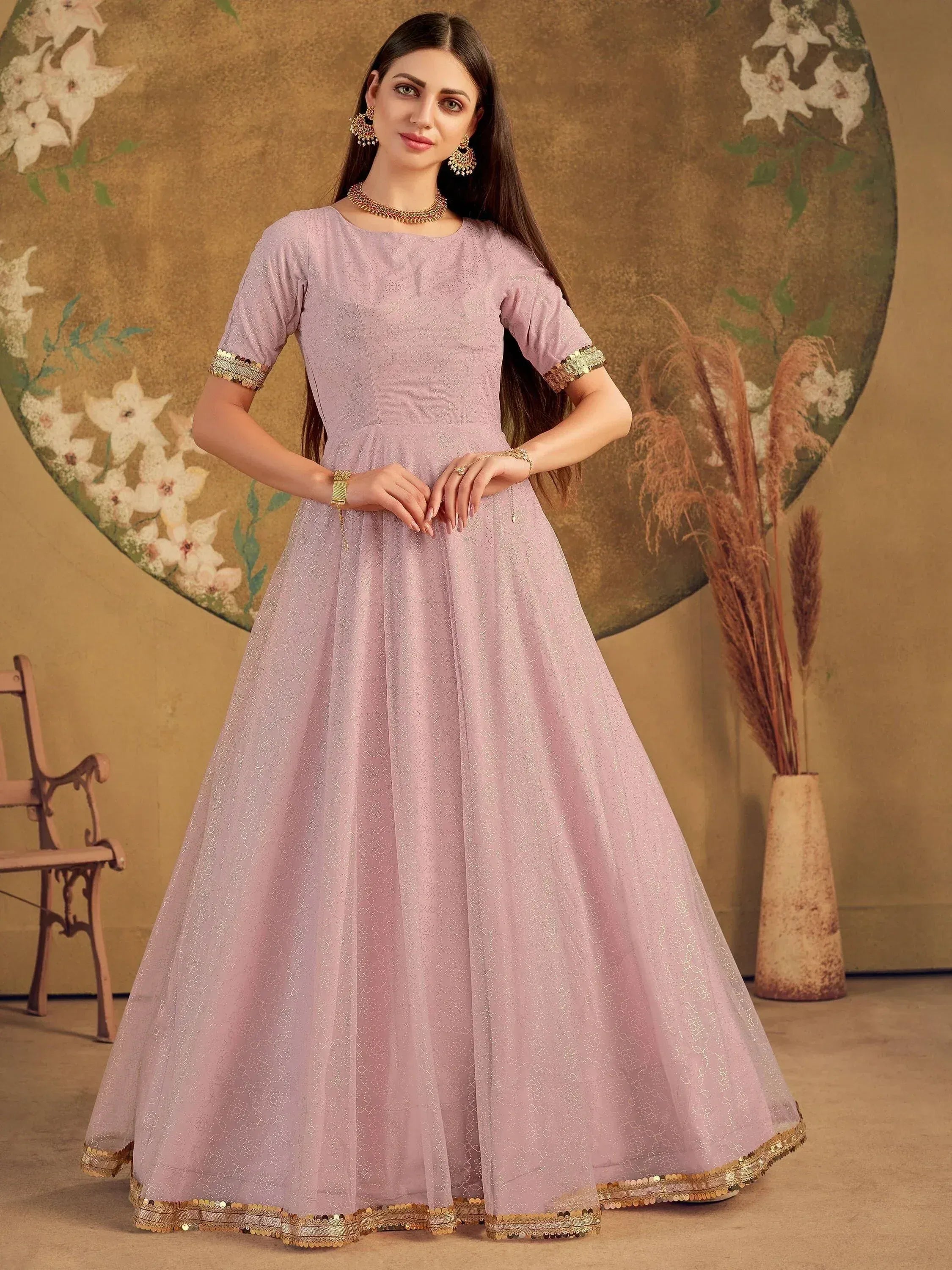 Elegant lavender ethnic gown with gold sequin trim, perfect for Indian festive occasions and weddings.